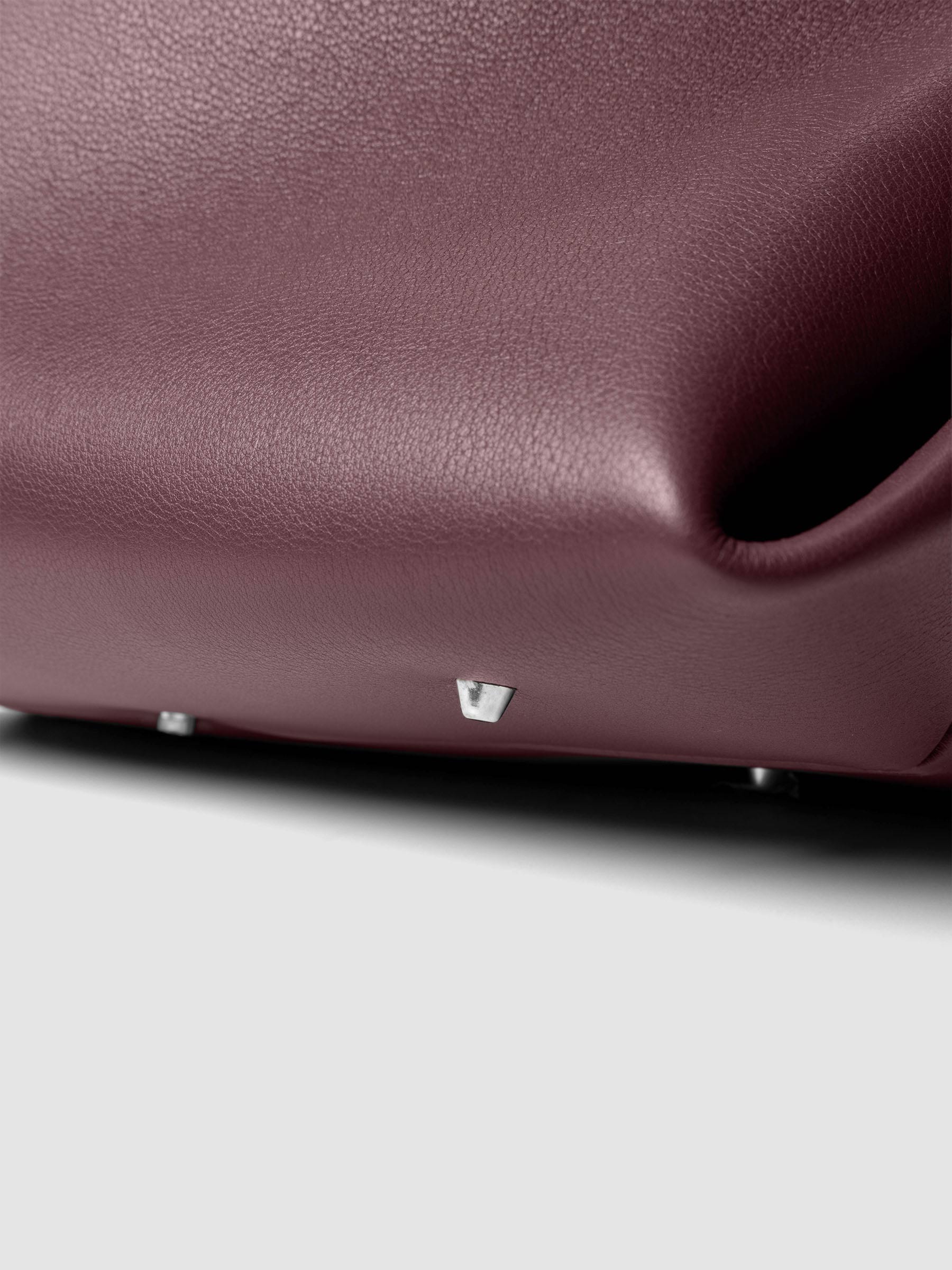 Detail view of a the bottom of The Metro Tote in the color Madrid.