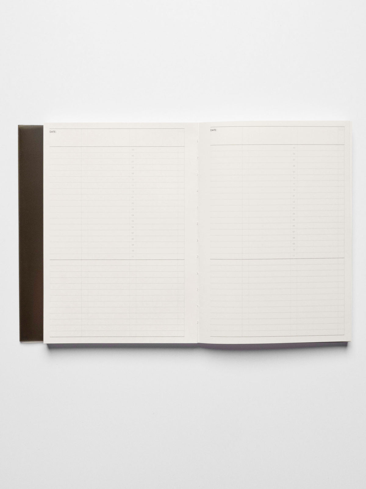 A5 notebook displayed open on a neutral background.