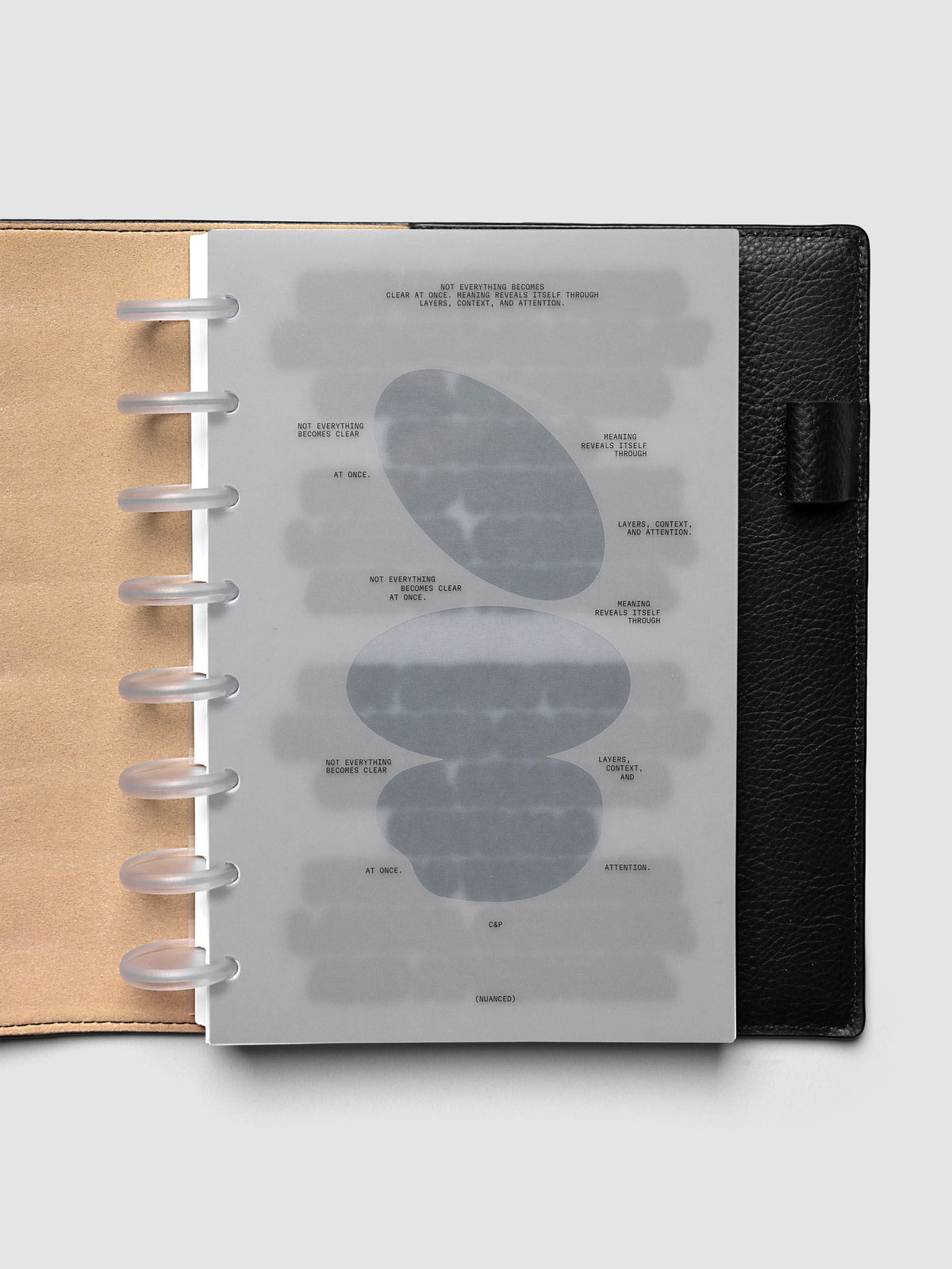 Nuanced Dashboard Trio, Half Letter 8-Disc Punch, dashboard on frosted discs in an open black leather planner, kraft panel at the left