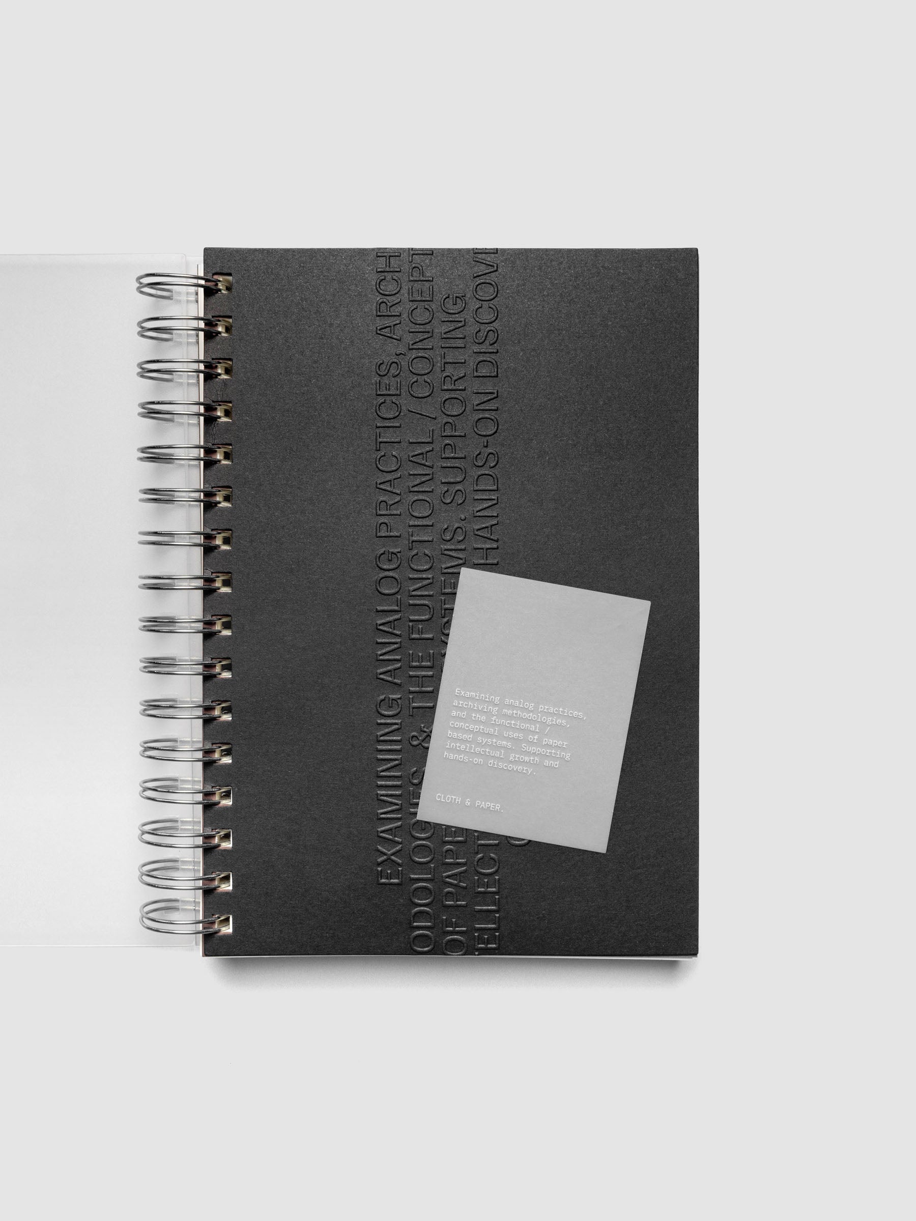Black embossed Analog Embossed Planner Dashboard with drop card shown in size A5 Spiral.