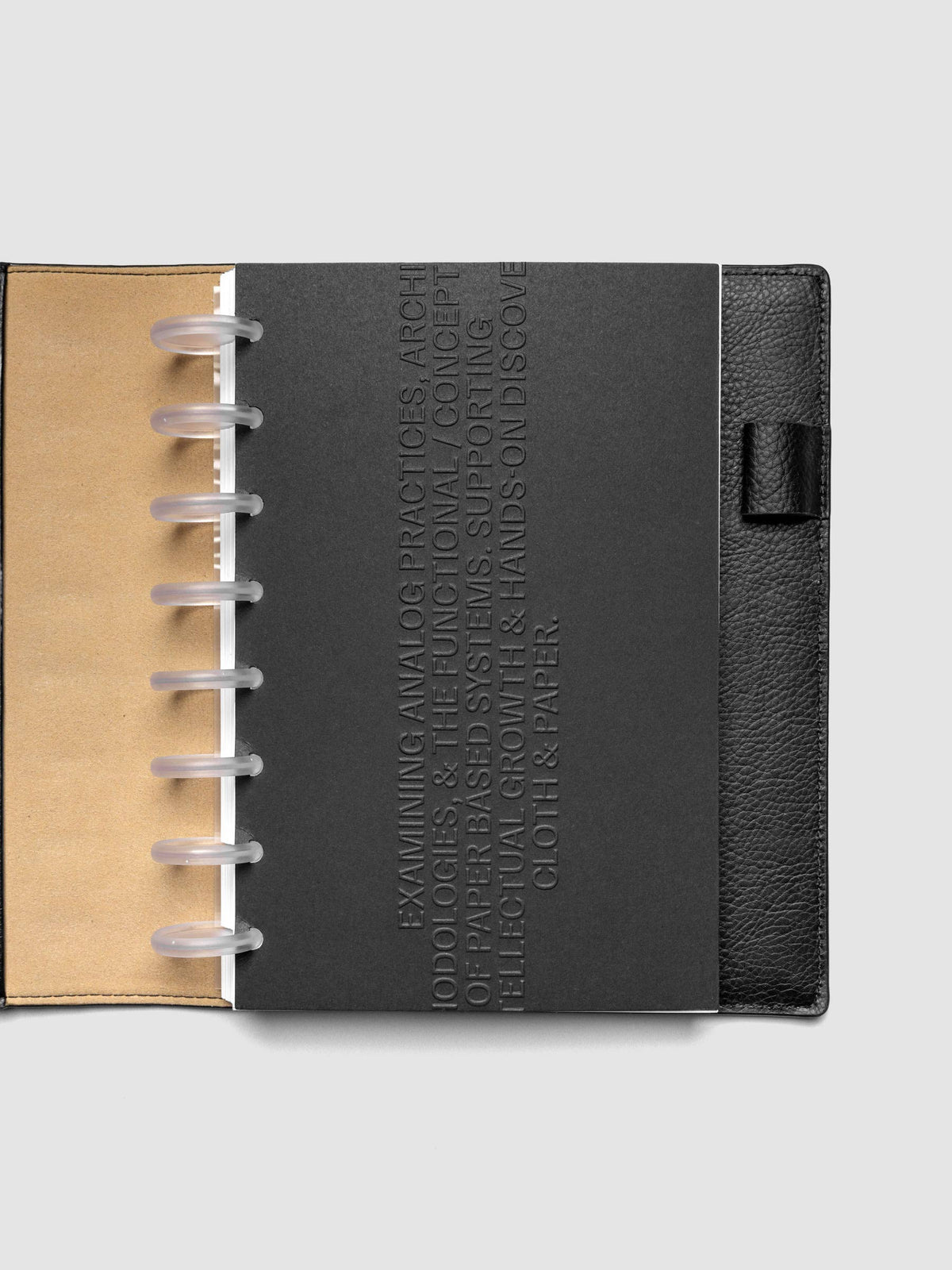 Black embossed Analog Embossed Planner Dashboard without the drop card shown in size Half Letter 8-Disc Punch.