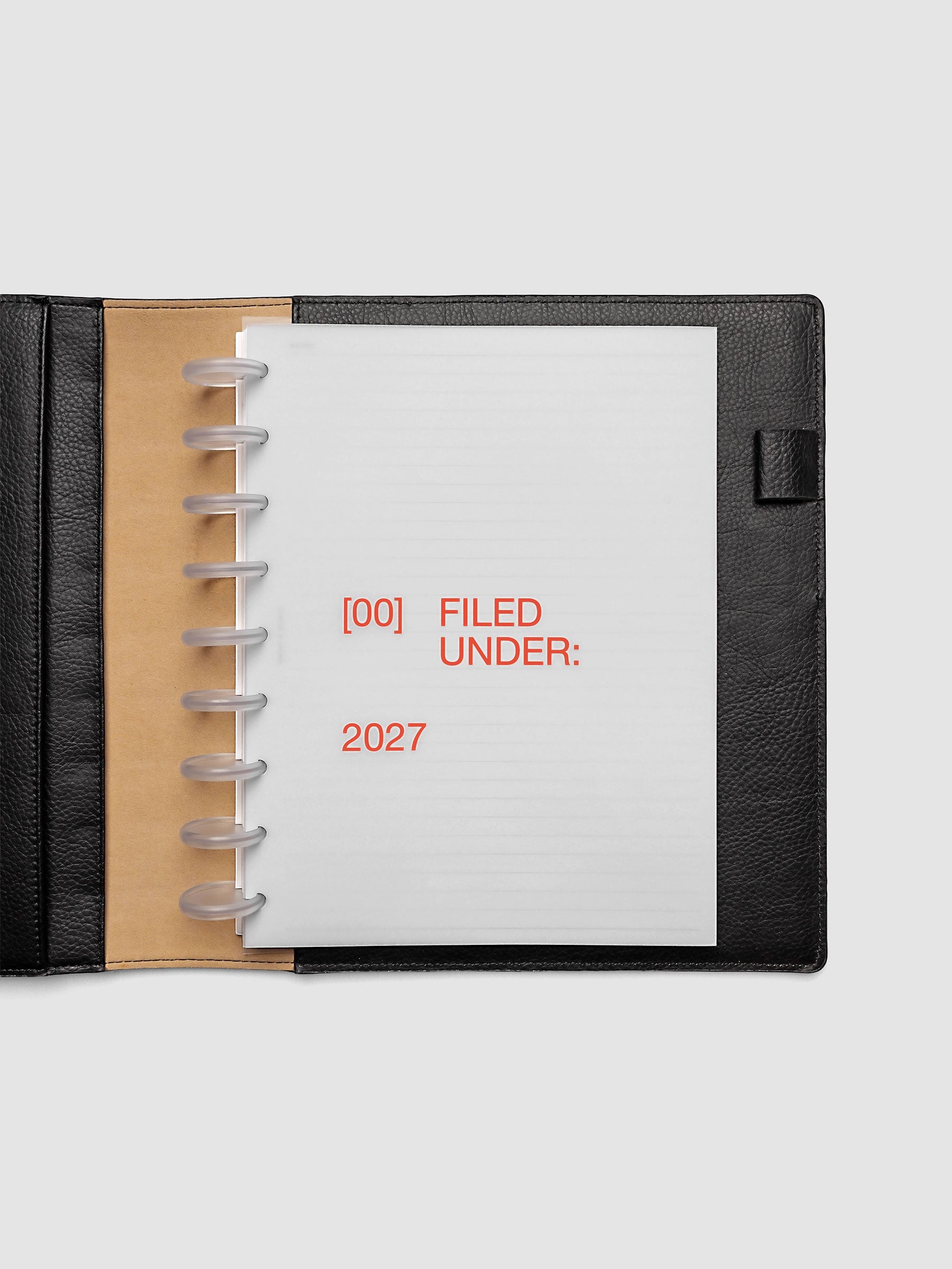 2027 Front + Monthly Dashboard Overlays, Saffron, HP Classic 9-Disc Punch, vellum dashboard overlay shown layered inside a planner