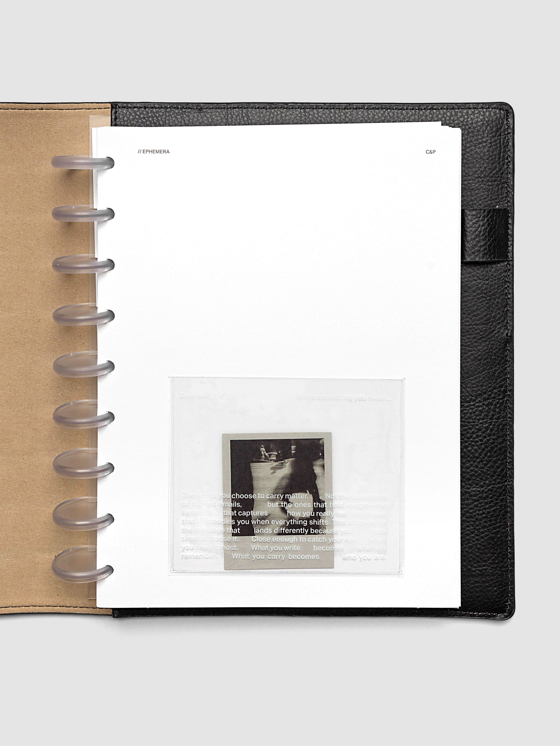White Ephemera Planner Dashboard shown in size HP Classic in a black leather folio.
