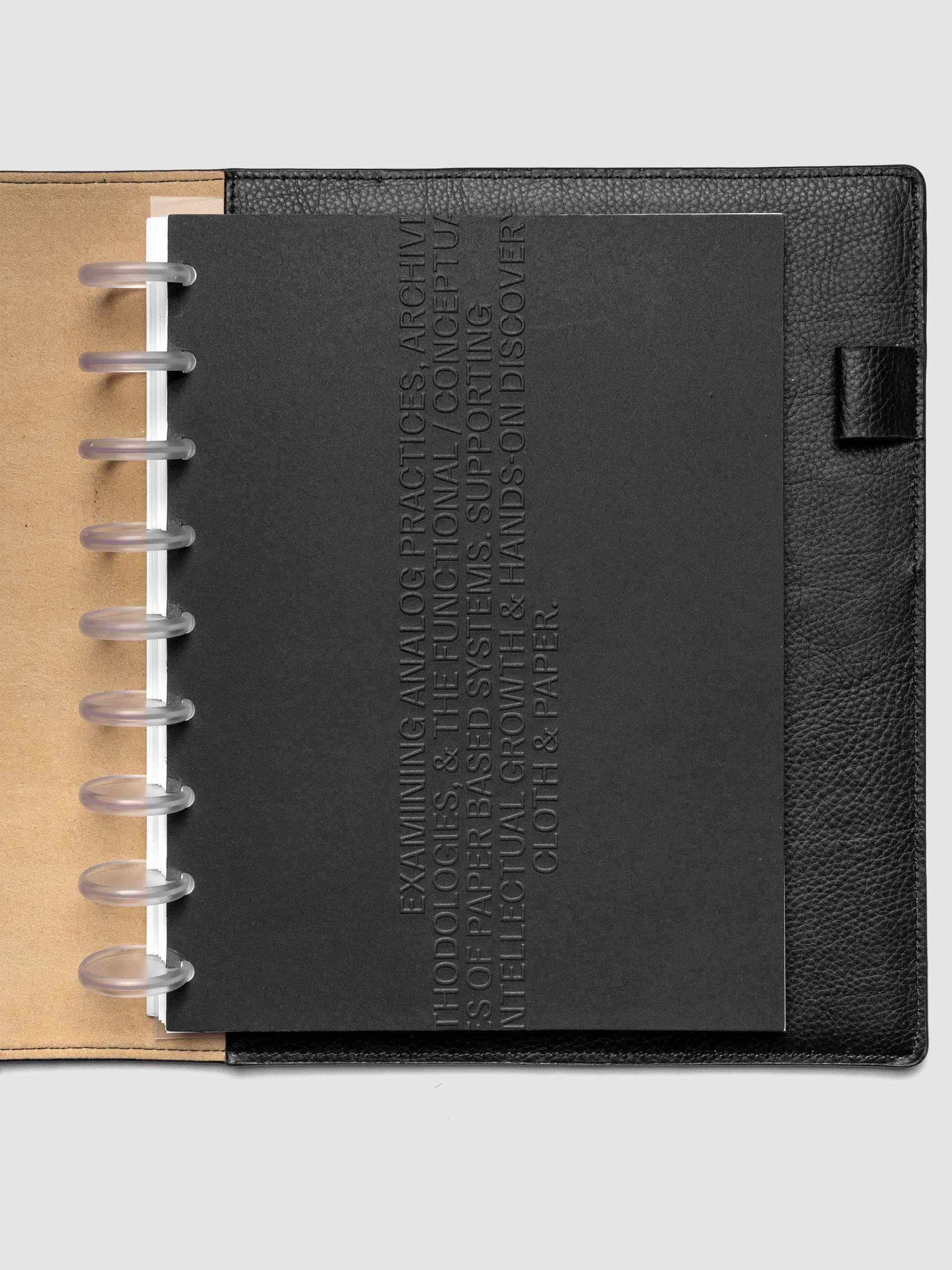 Black embossed Analog Embossed Planner Dashboard without the drop card shown in size HP Classic 9-Disc Punch.