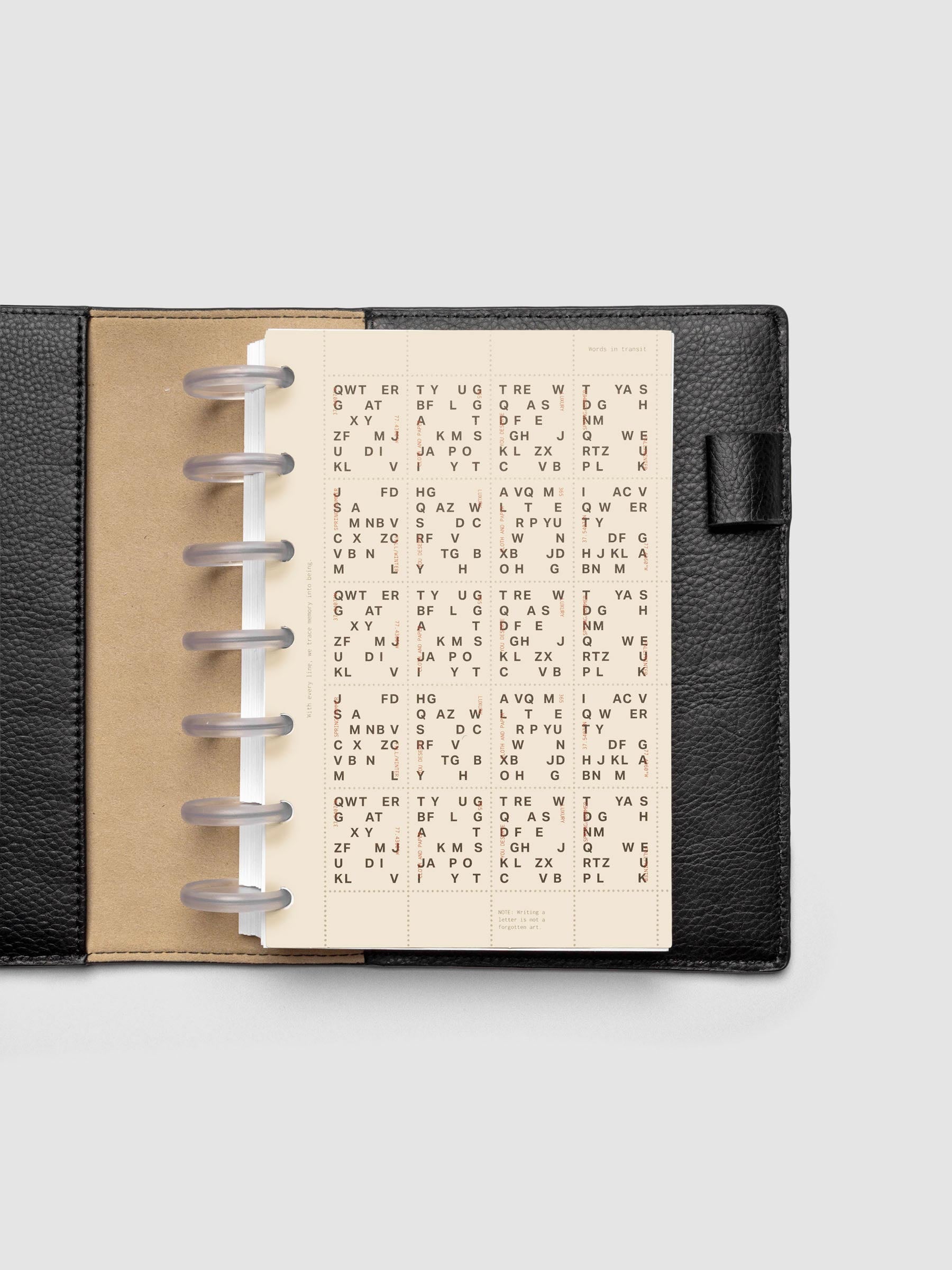 Stamp Sheet Planner Dashboard shown in a HP Mini black leather folio.