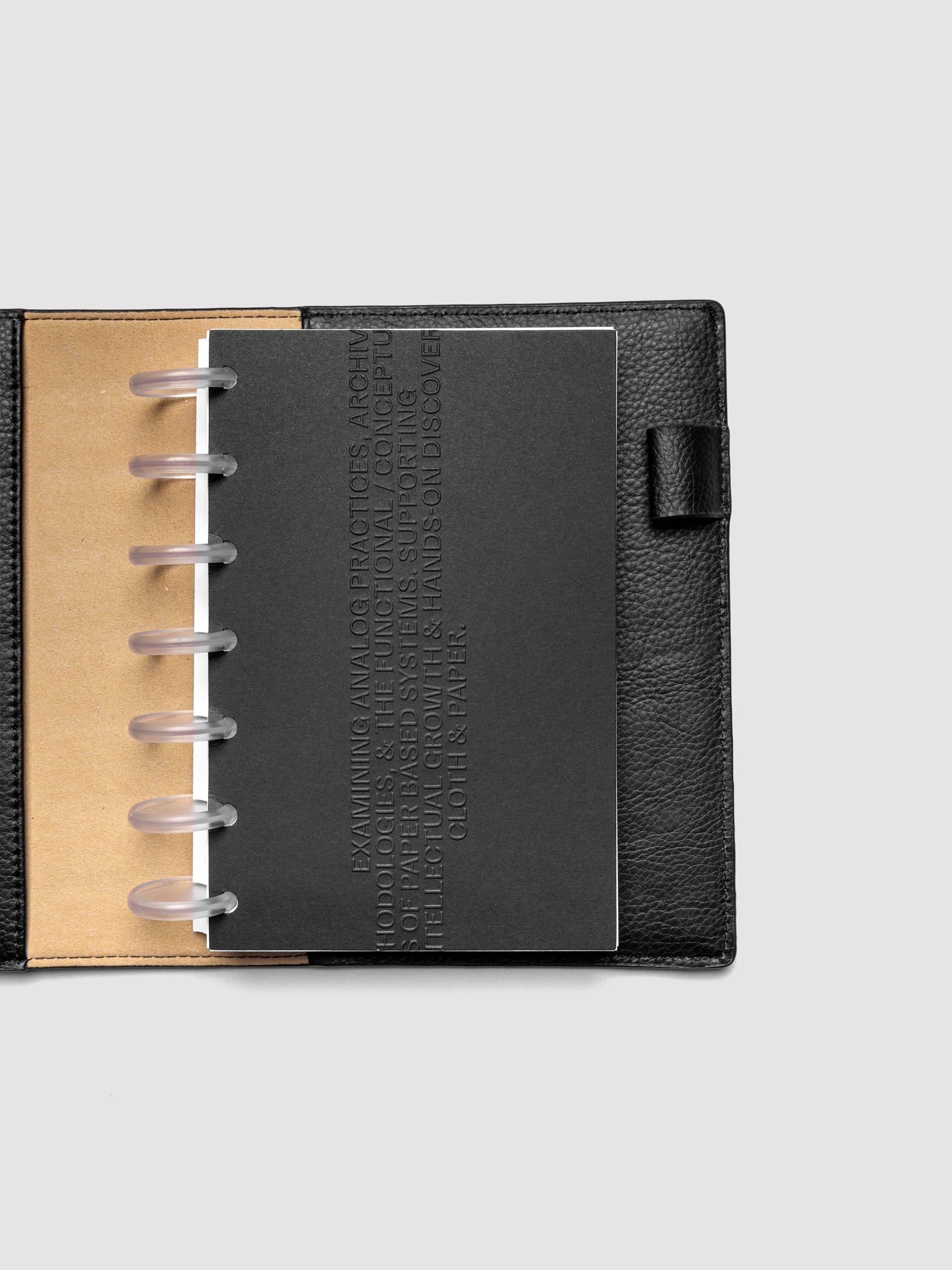 Black embossed Analog Embossed Planner Dashboard without the drop card shown in size HP Mini.