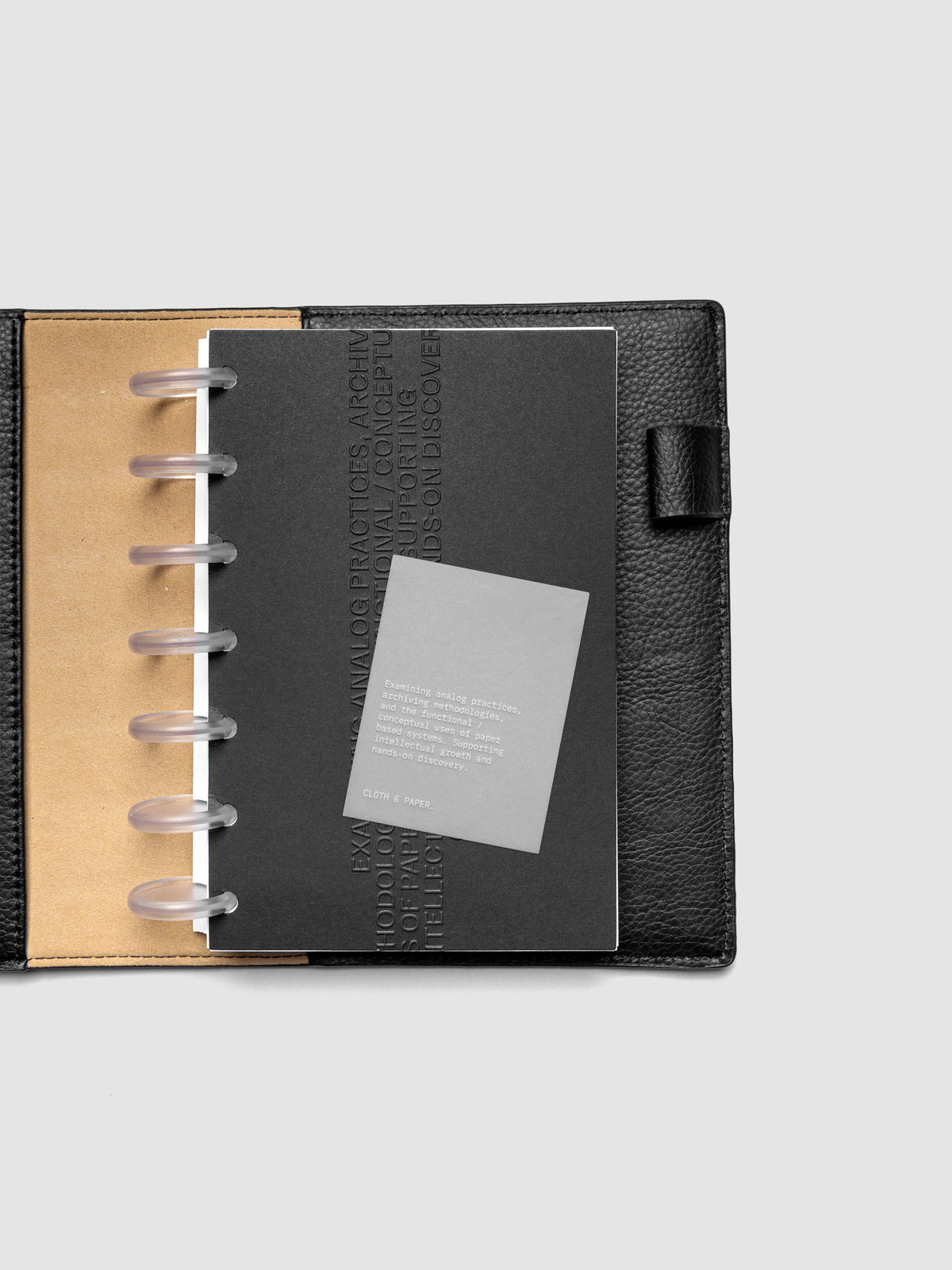 Black embossed Analog Embossed Planner Dashboard with drop card shown in size HP Mini.