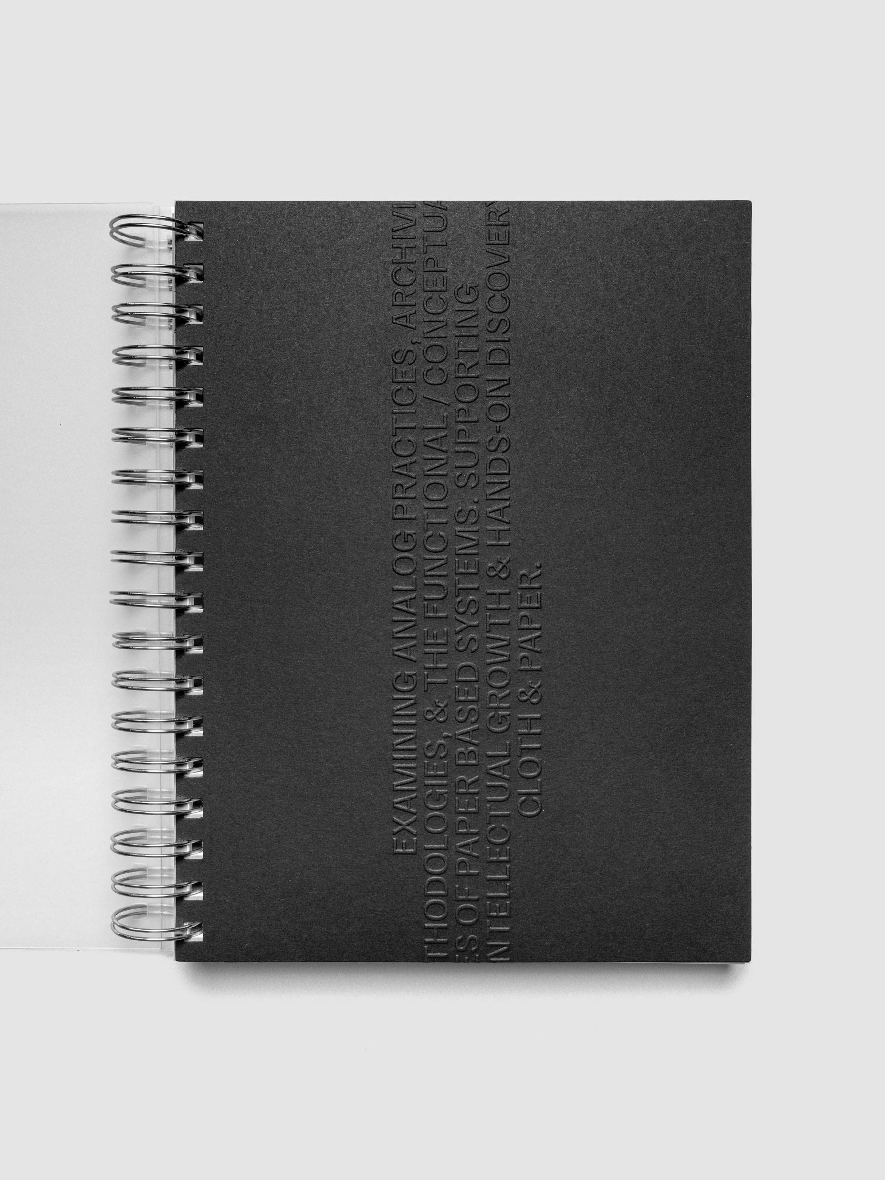 Black embossed Analog Embossed Planner Dashboard without the drop card shown in size HP Classic Spiral.
