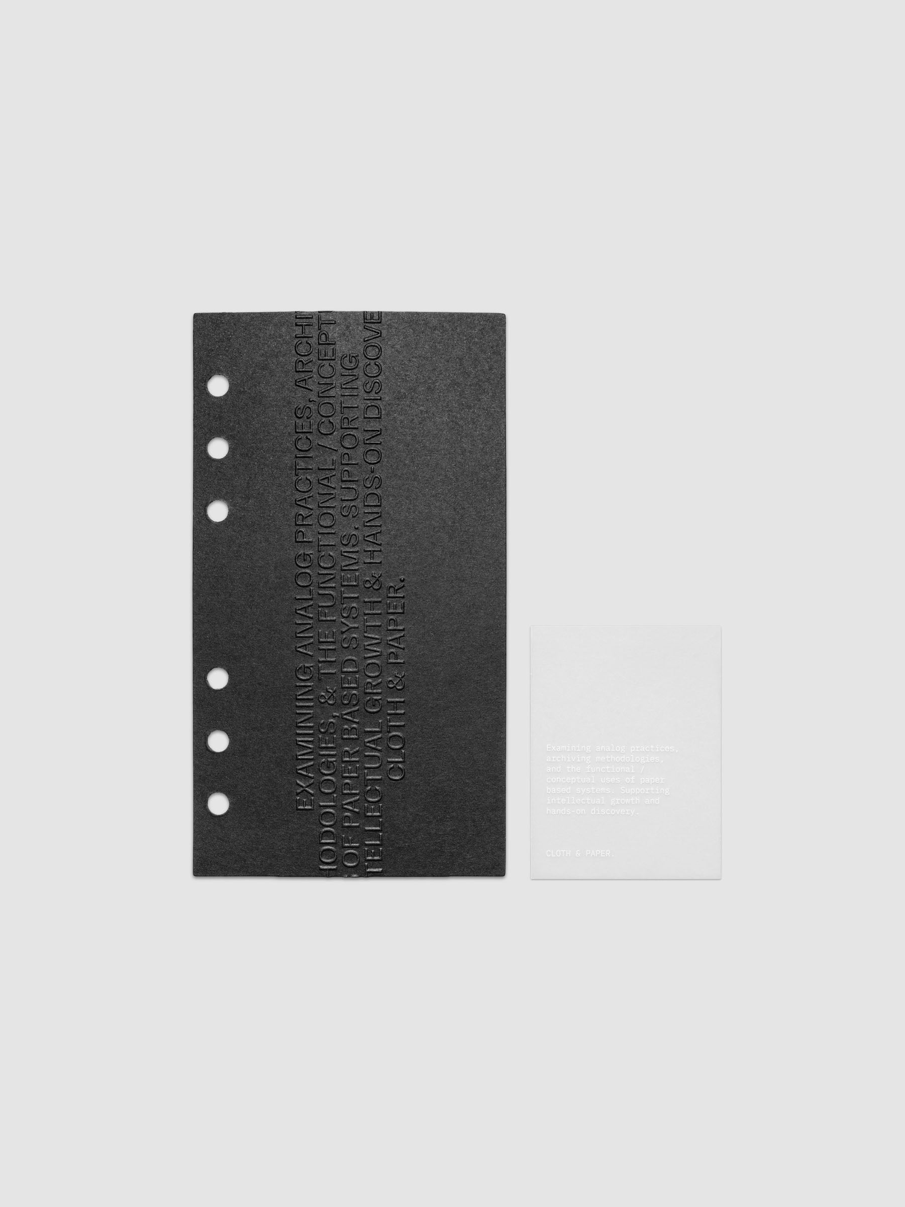 Black embossed Analog Embossed Planner Dashboard with drop card shown in size Personal.