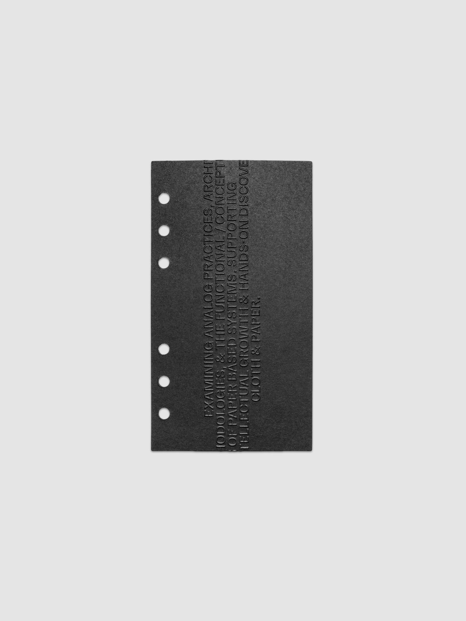Black embossed Analog Embossed Planner Dashboard without the drop card shown in size Personal.