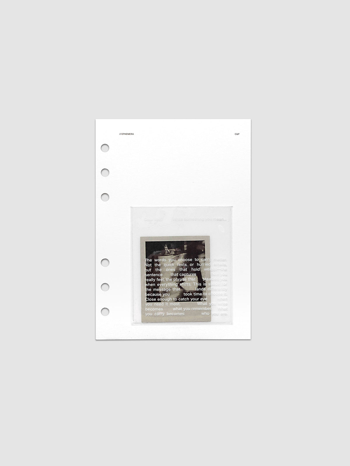 White Ephemera Planner Dashboard with transparent pocket and journaling card shown pre-punched for Personal Wide 6-ring planners.