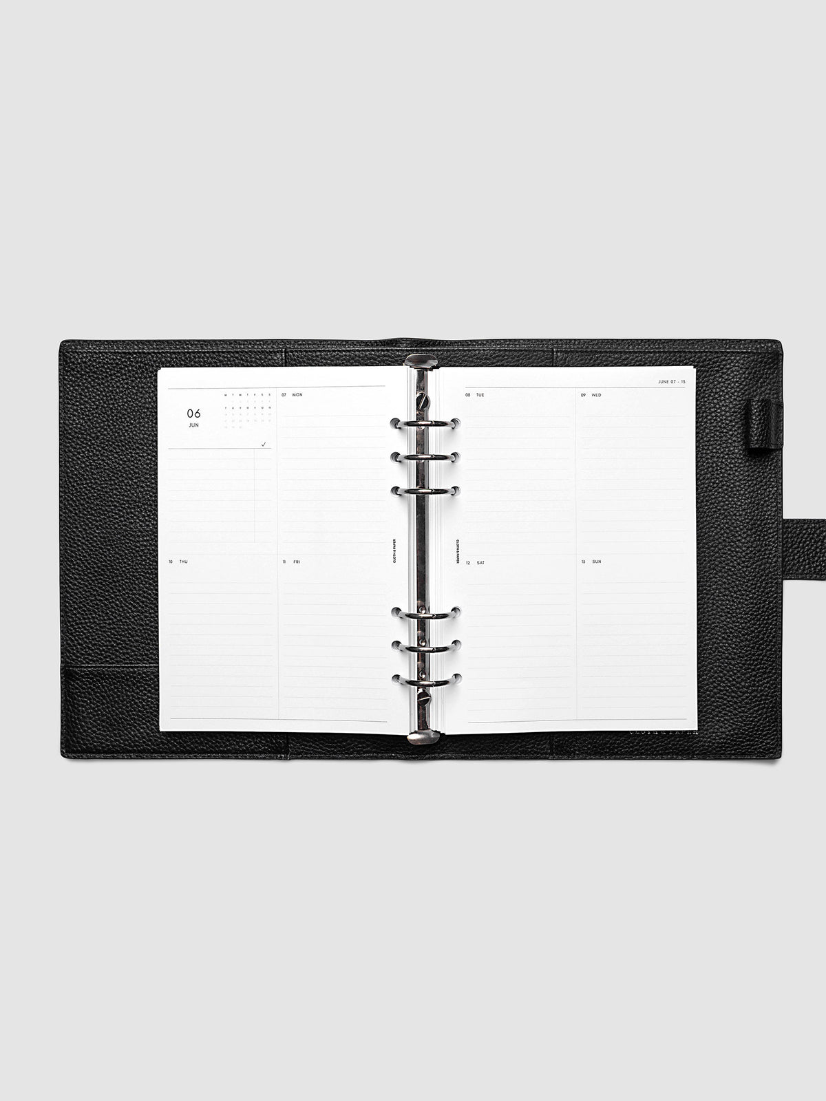 Both pages inside planner: 2027 Dated Weekly Vertical Planner Inserts, Monday Start, A5 6-Ring Punch, full week-on-two-pages spread showing a two-column two-row daily grid with lined sections, mini monthly calendar and task list in the top left, shown inside a planner