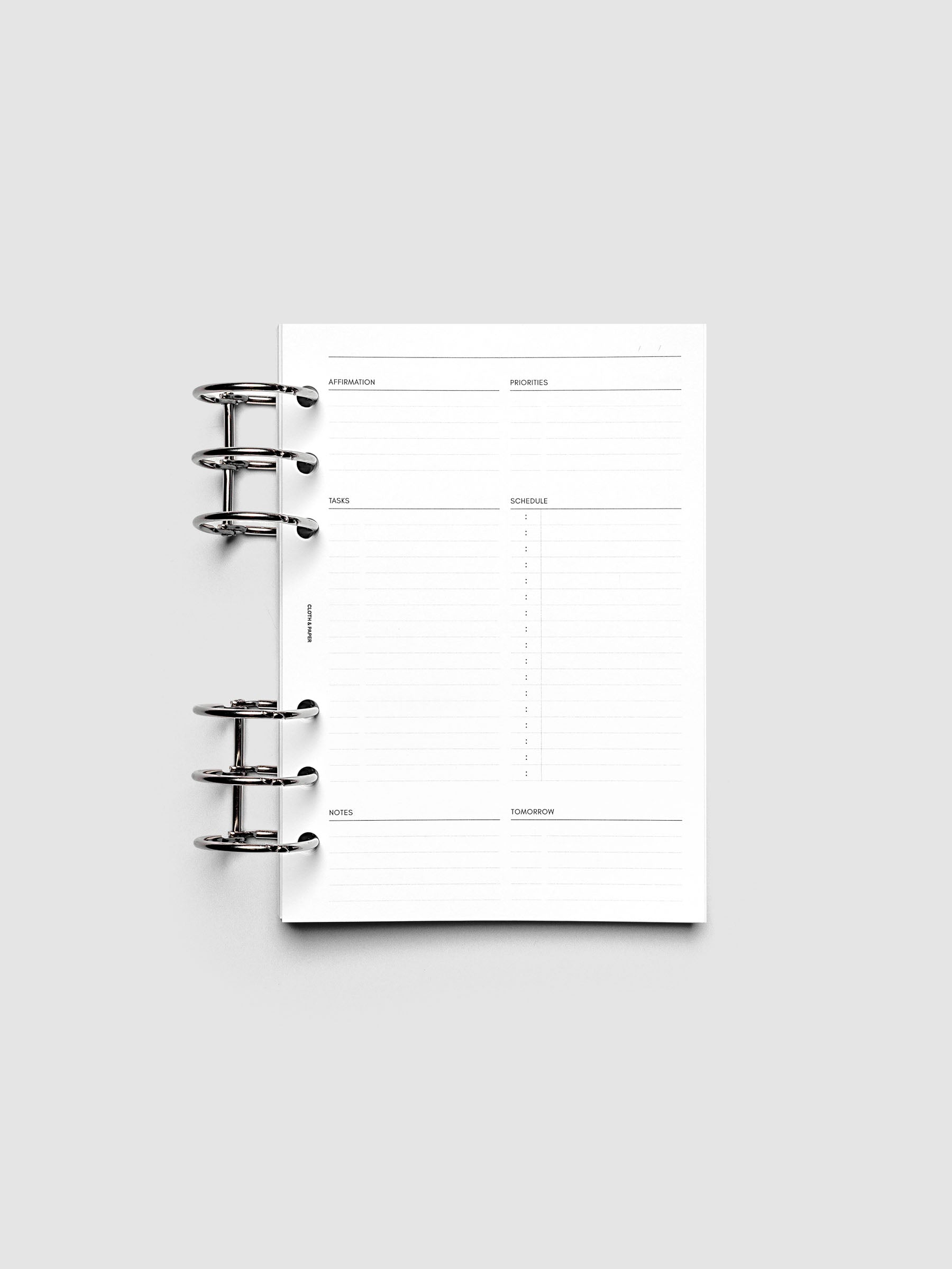 Daily Essentials Planner Inserts shown ring bound in size Personal Wide.