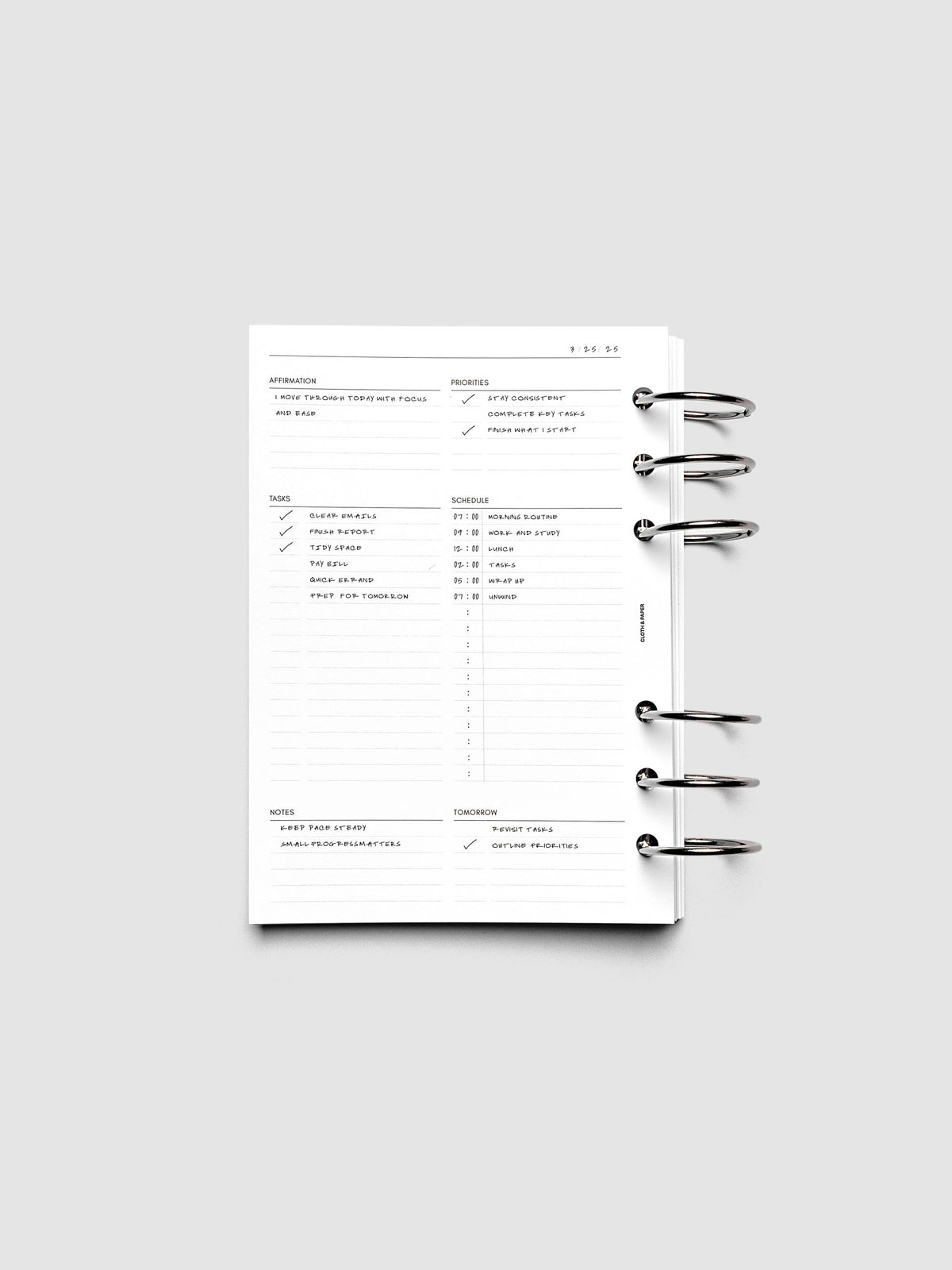 Demo page for the Daily Essentials Planner Inserts shown ring bound in size Personal Wide.