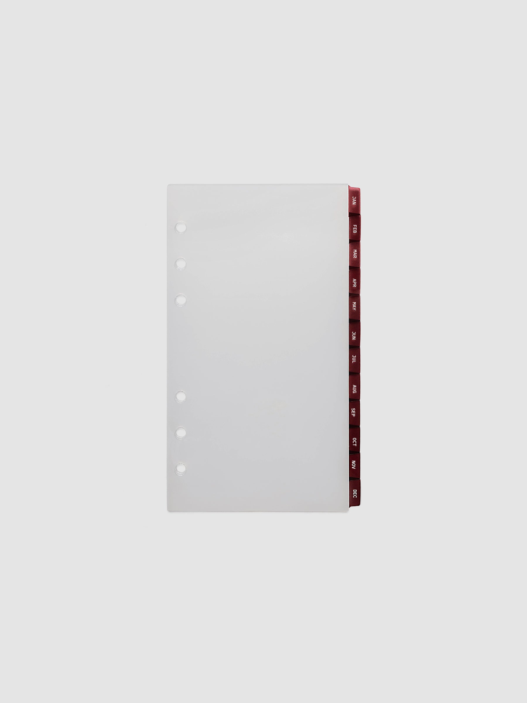 Personal 6-Ring Punch Ultra-Thin Monthly Dividers in deep red, set of 12 dividers fanned to show all months