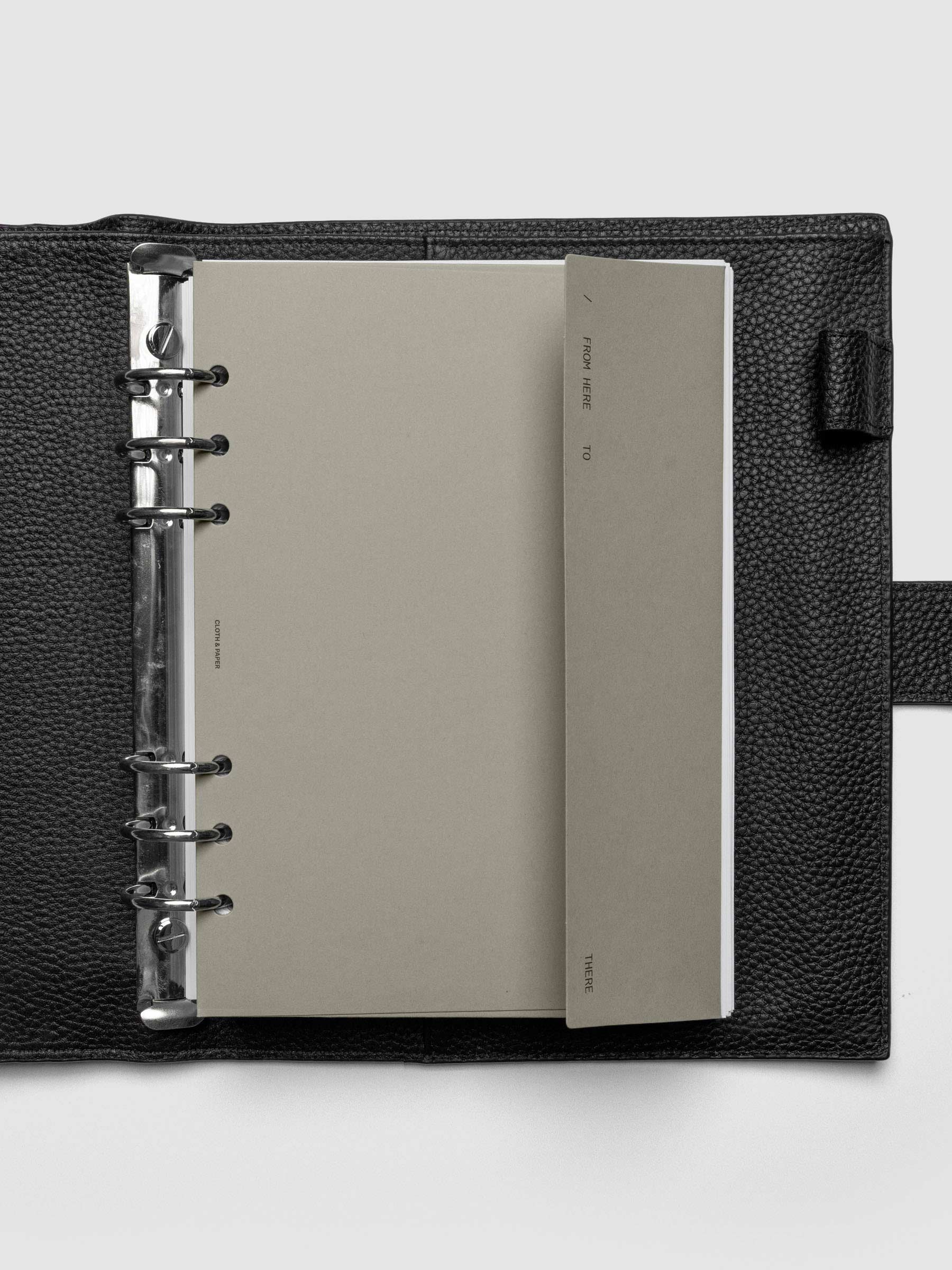 Beige Envelope Storage Holder shown inside a black, leather A5 agenda.