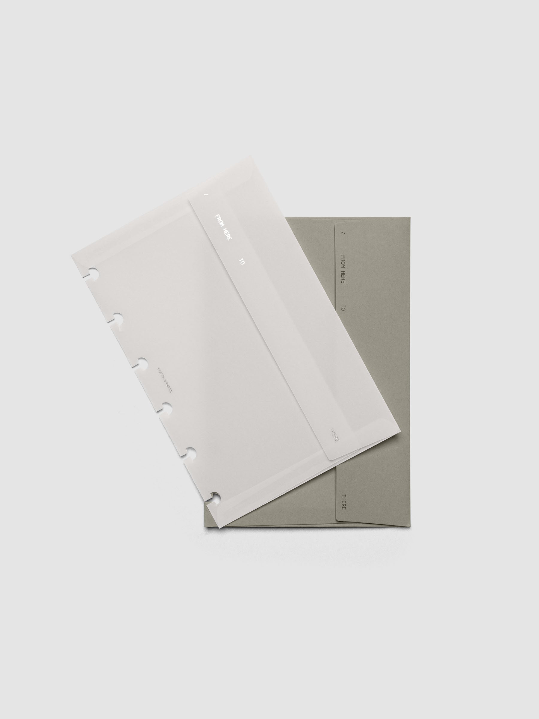 Envelope Storage Holder Set shown pre-punched for CP Petite discbound planners.