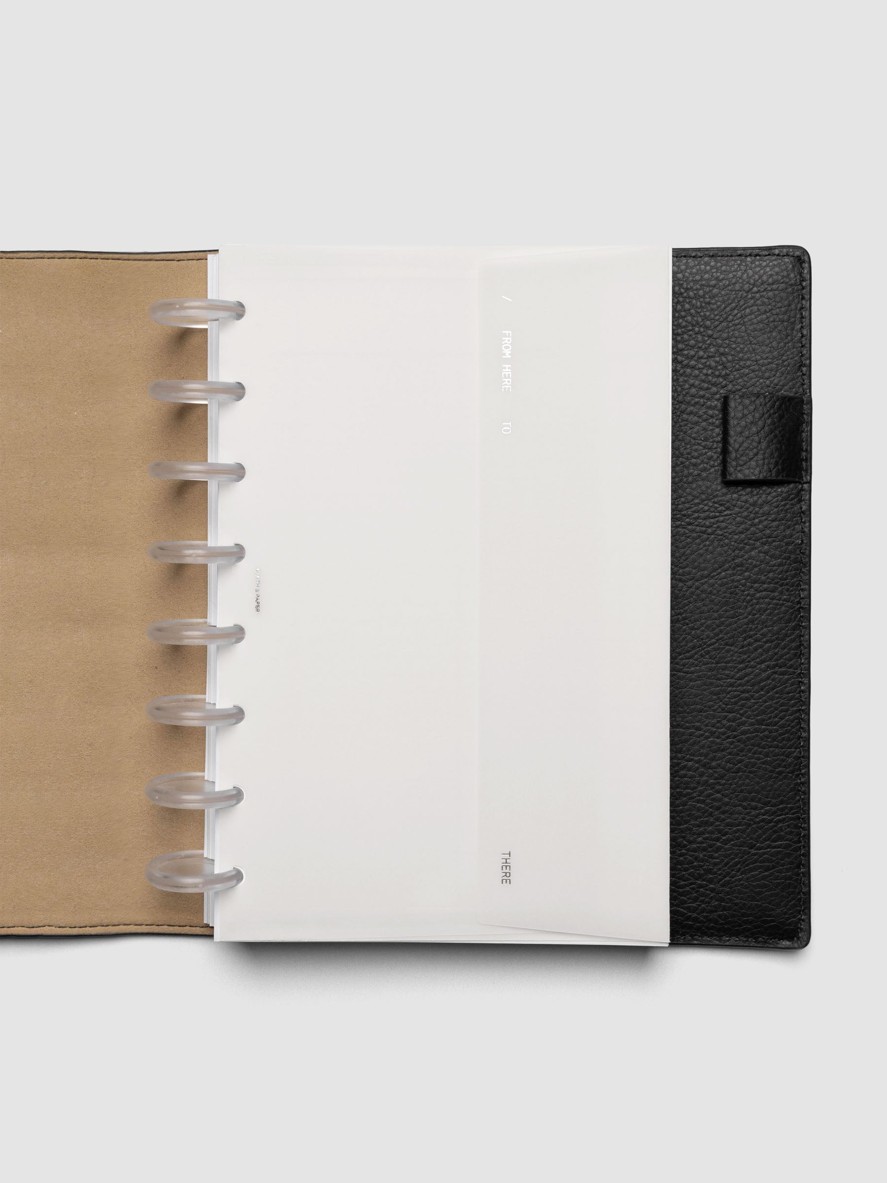 White Envelope Storage Holder shown inside a black, leather Half Letter folio.