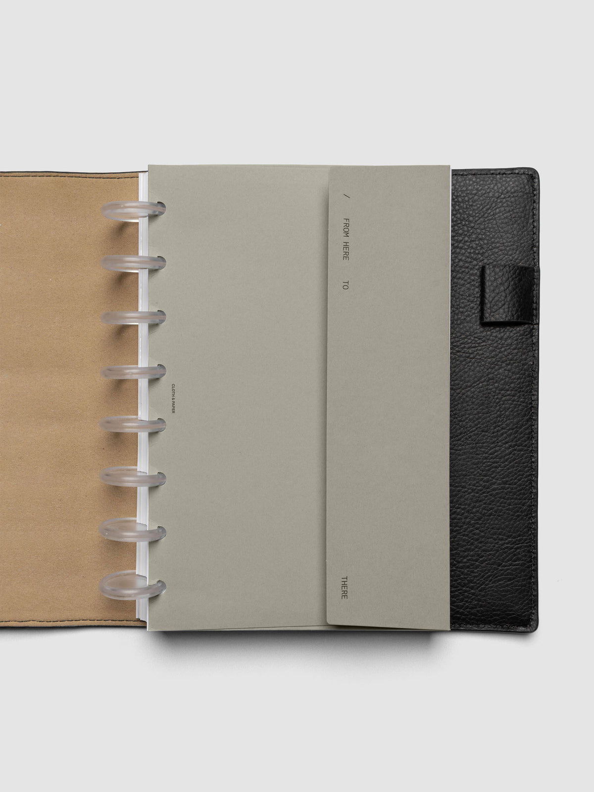 Beige Envelope Storage Holder shown inside a black, leather Half Letter folio.