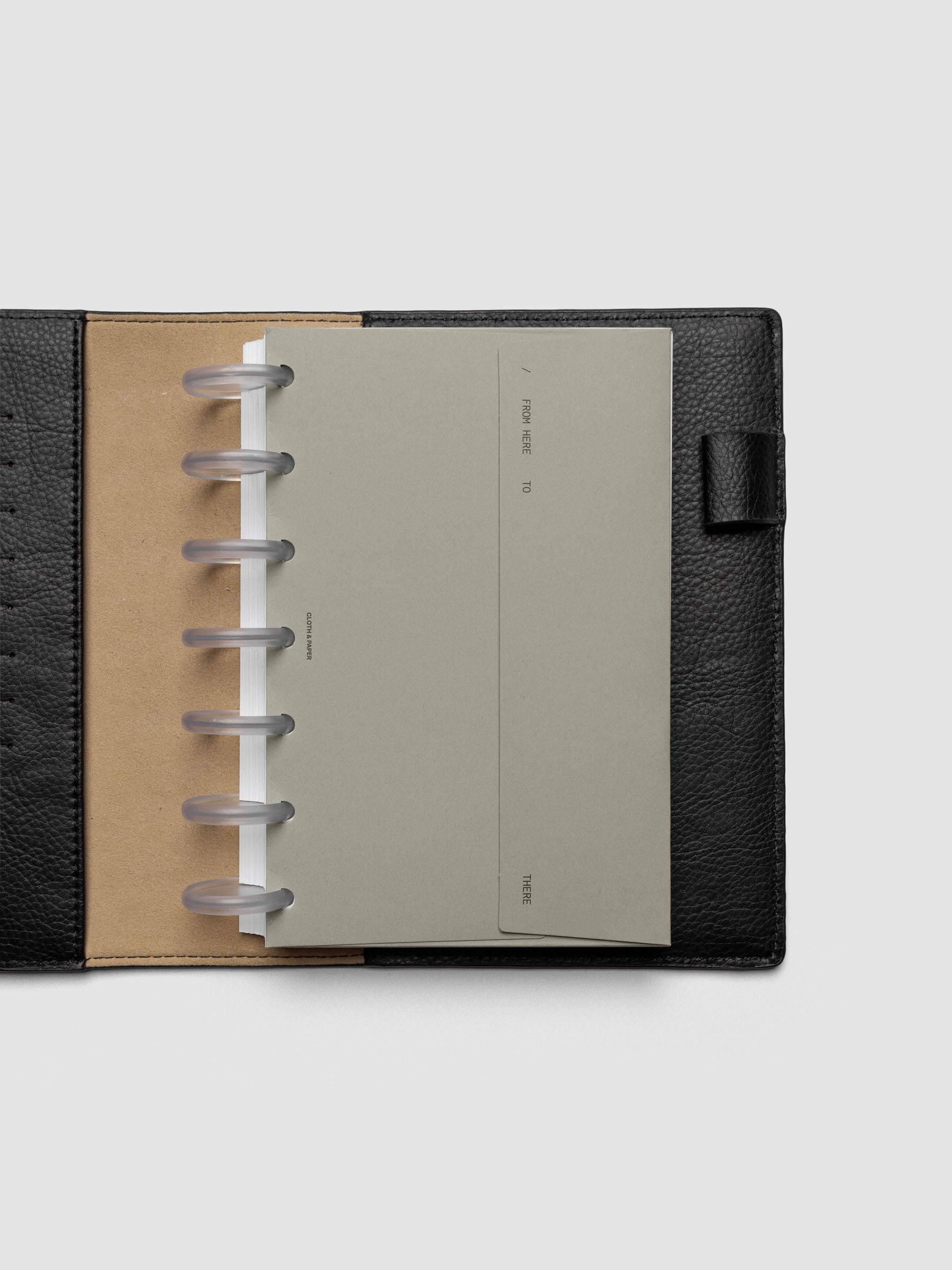 Beige Envelope Storage Holder shown inside a black, leather HP Mini folio.