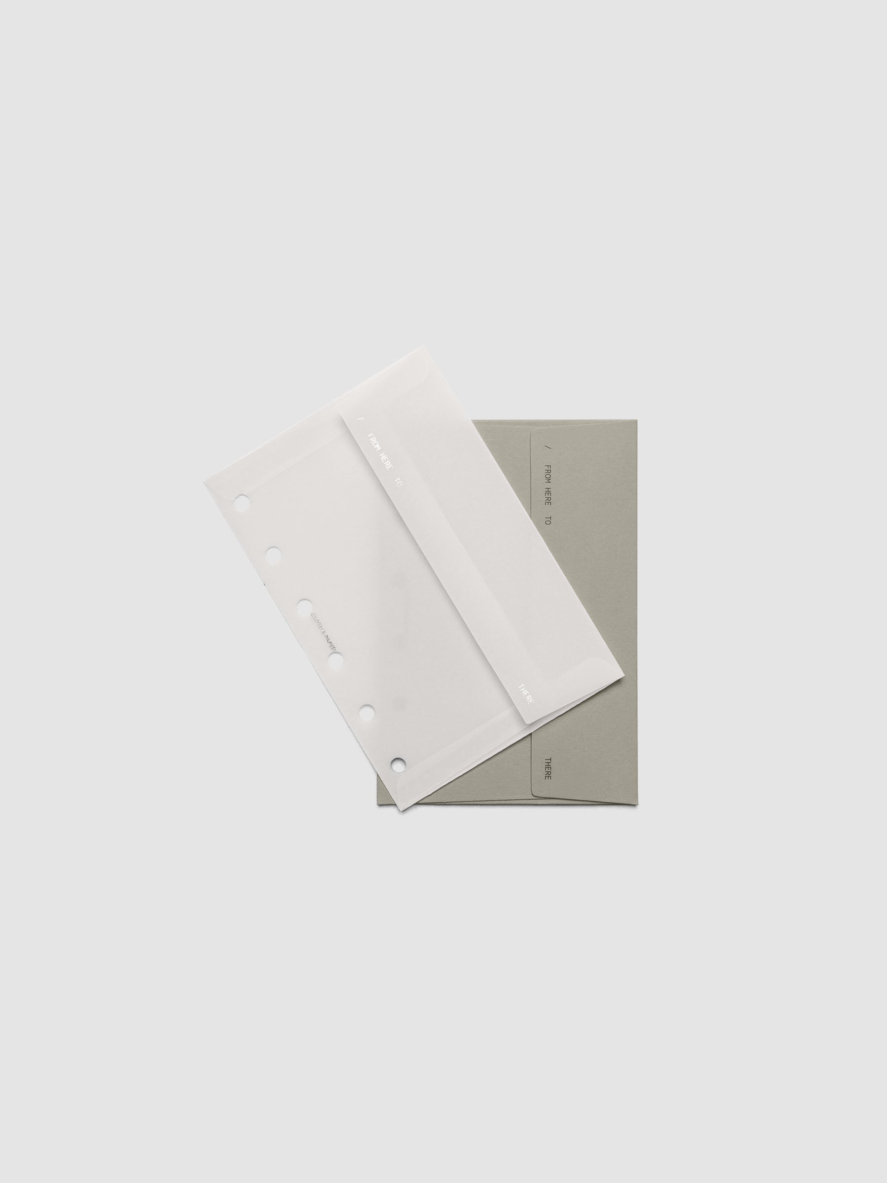 Envelope Storage Holder Set shown pre-punched for Pocket 6-Ring planners.