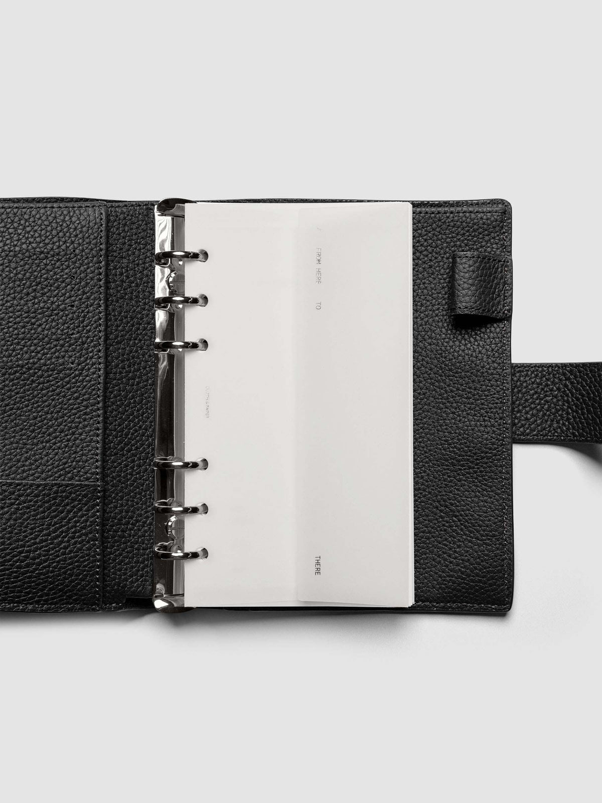 White Envelope Storage Holder shown inside a black, leather Pocket agenda.