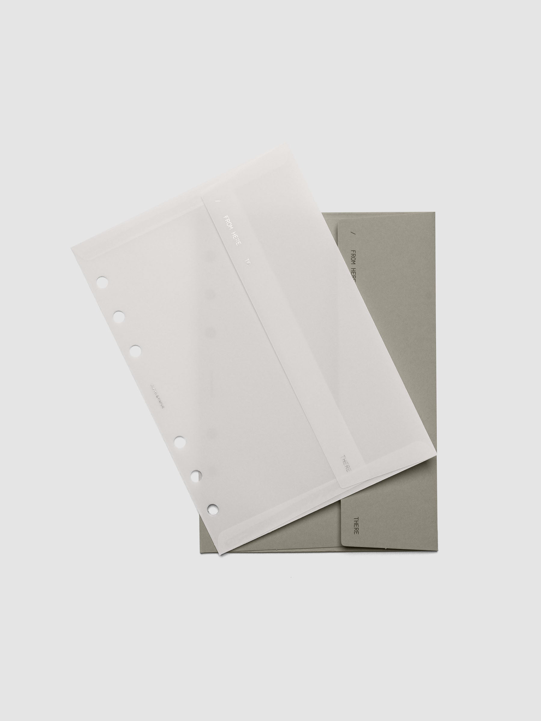 Envelope Storage Holder Set shown pre-punched for Personal Wide 6-Ring planners.