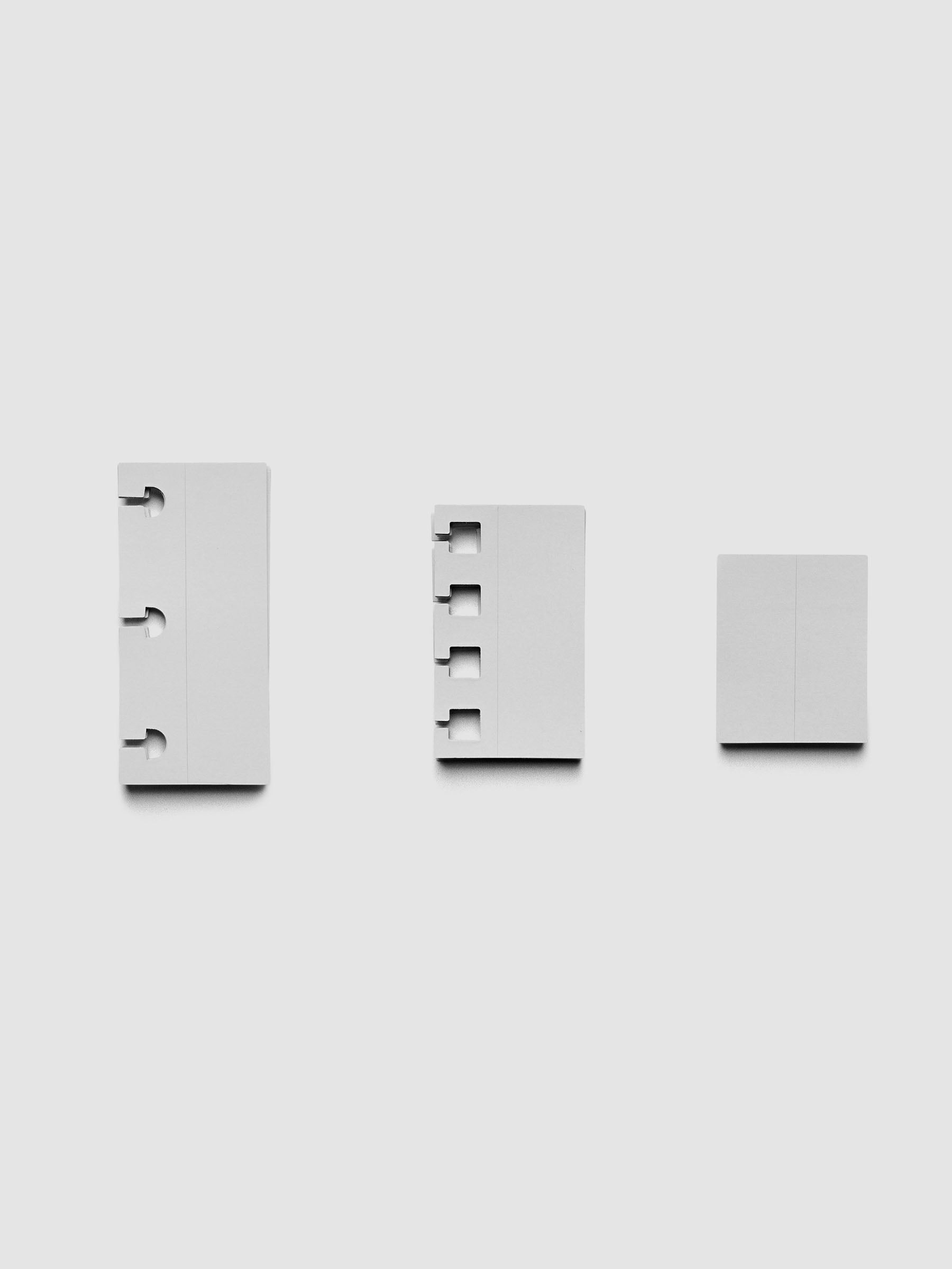 Disc punch, spiral punch, and unpunched system punch stickers shown against a grey background.