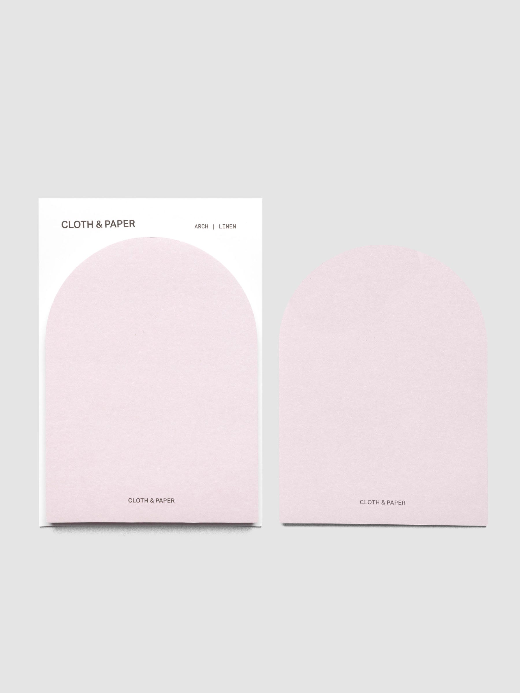 A set of Linen (light pink) Arched Sticky Notes with one peeled off and shown to the side | Cloth & Paper