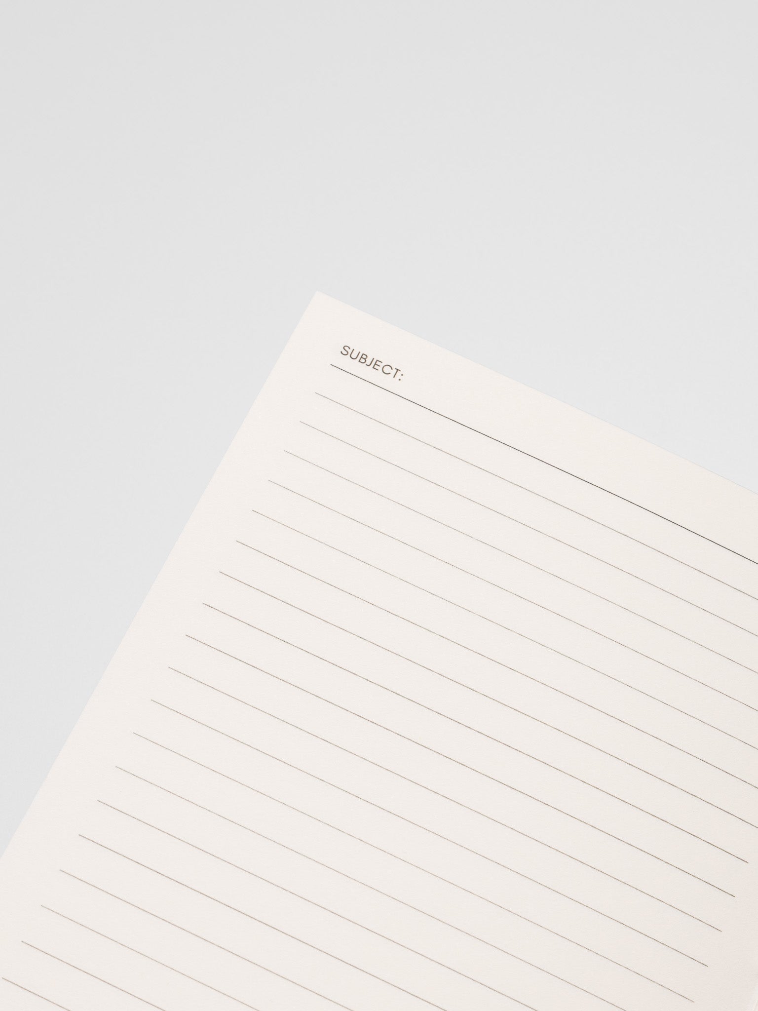 Close up of the Common Thread Notebook showing the white, lined interior pages.