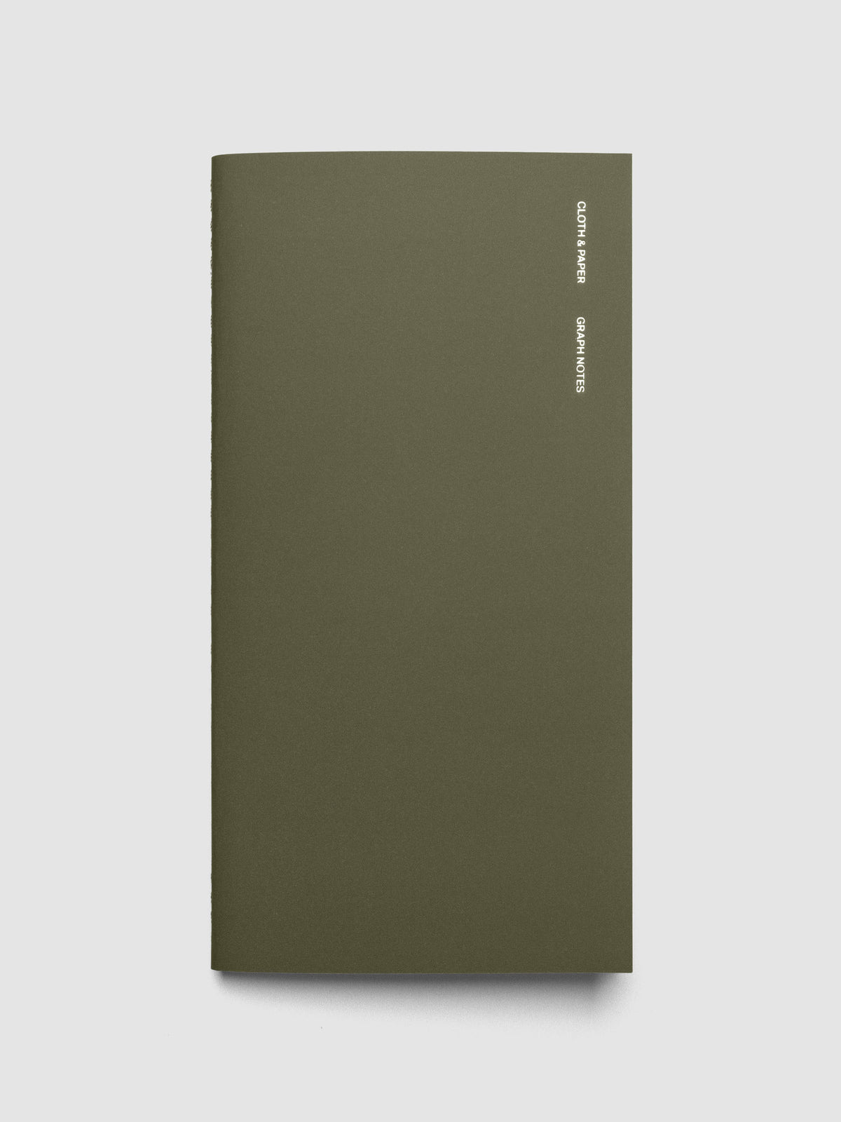 Exterior of a green a5 slim sized travel notebook.