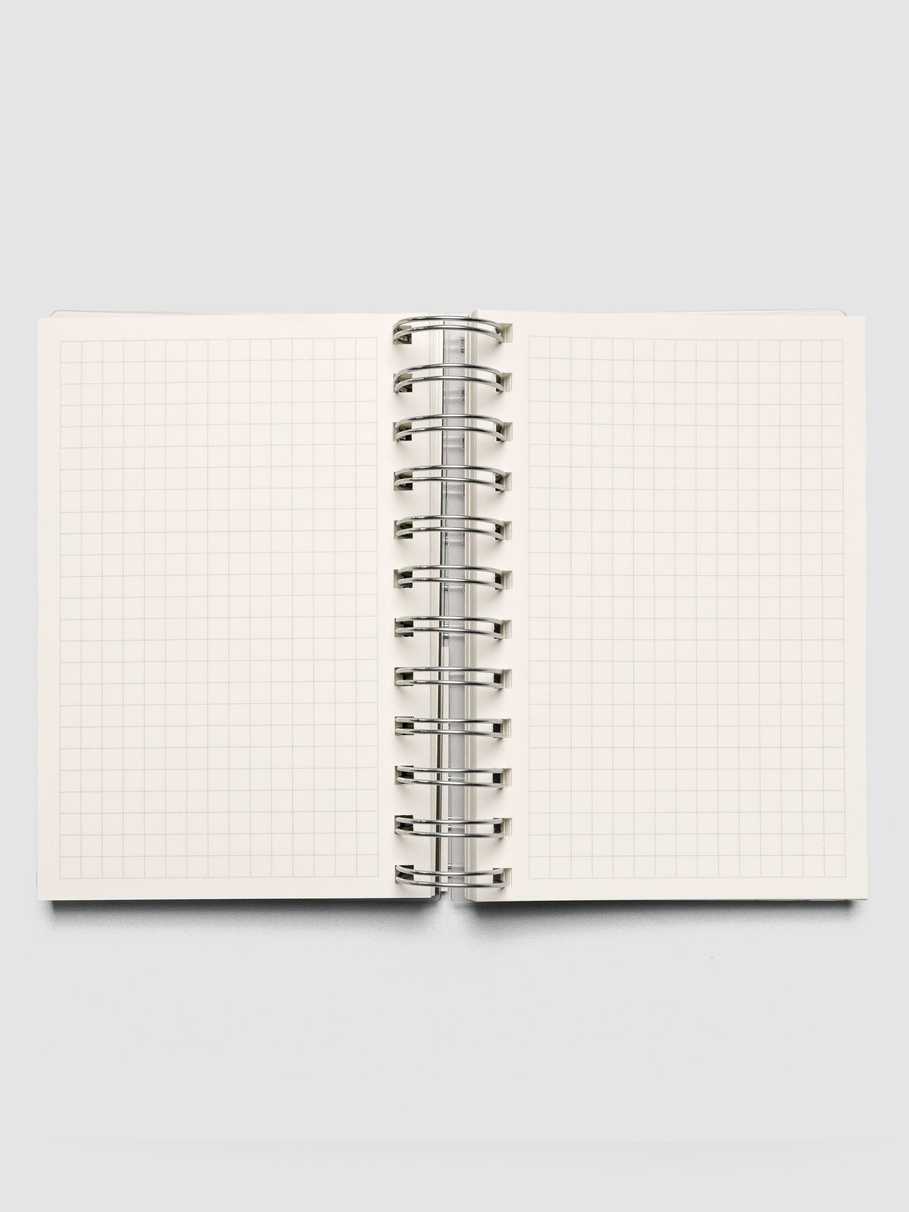 Spiral Notebook in size CP Petite with Graph Notes interior shown open displaying both left and right pages.