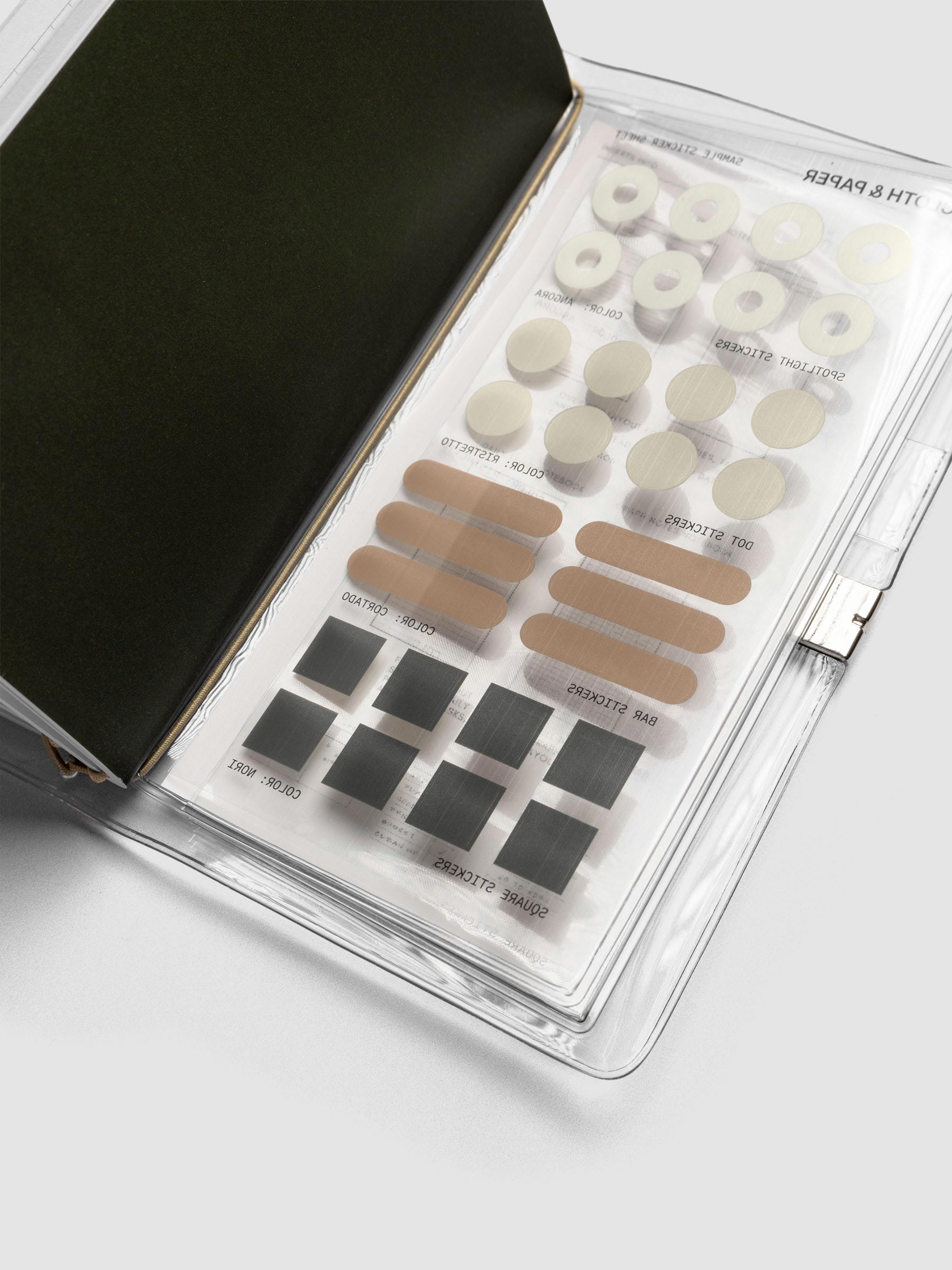 A pocket plus sized sticker sheets with spotlight, dot, bar, and square stickers in various colors.