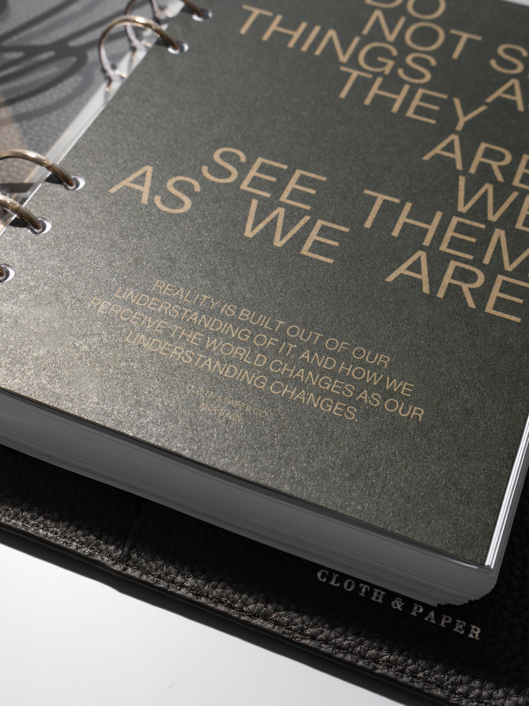 As We Are Cover + Dashboard Set in size A5 shown ring bound in a black leather agenda close up.