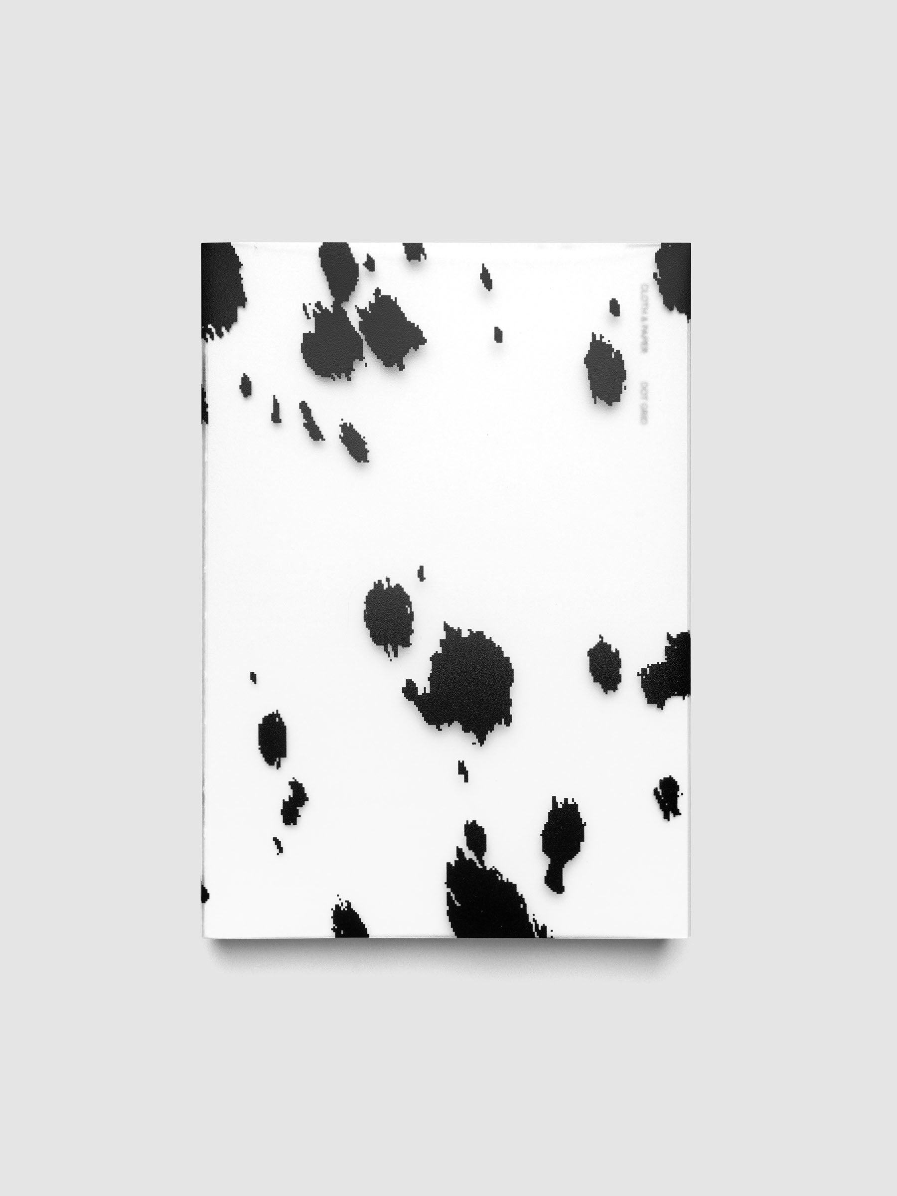 A5 frosted plastic notebook cover with black dalmatian animal print pattern on a Perfect Bound Notebook
