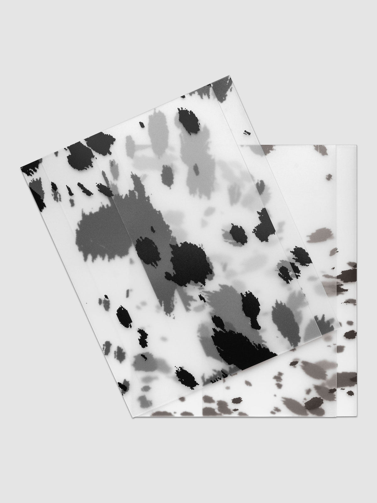 Two HP Classic frosted plastic notebook covers with dalmatian animal print pattern stacked and offset, shown in black and brown
