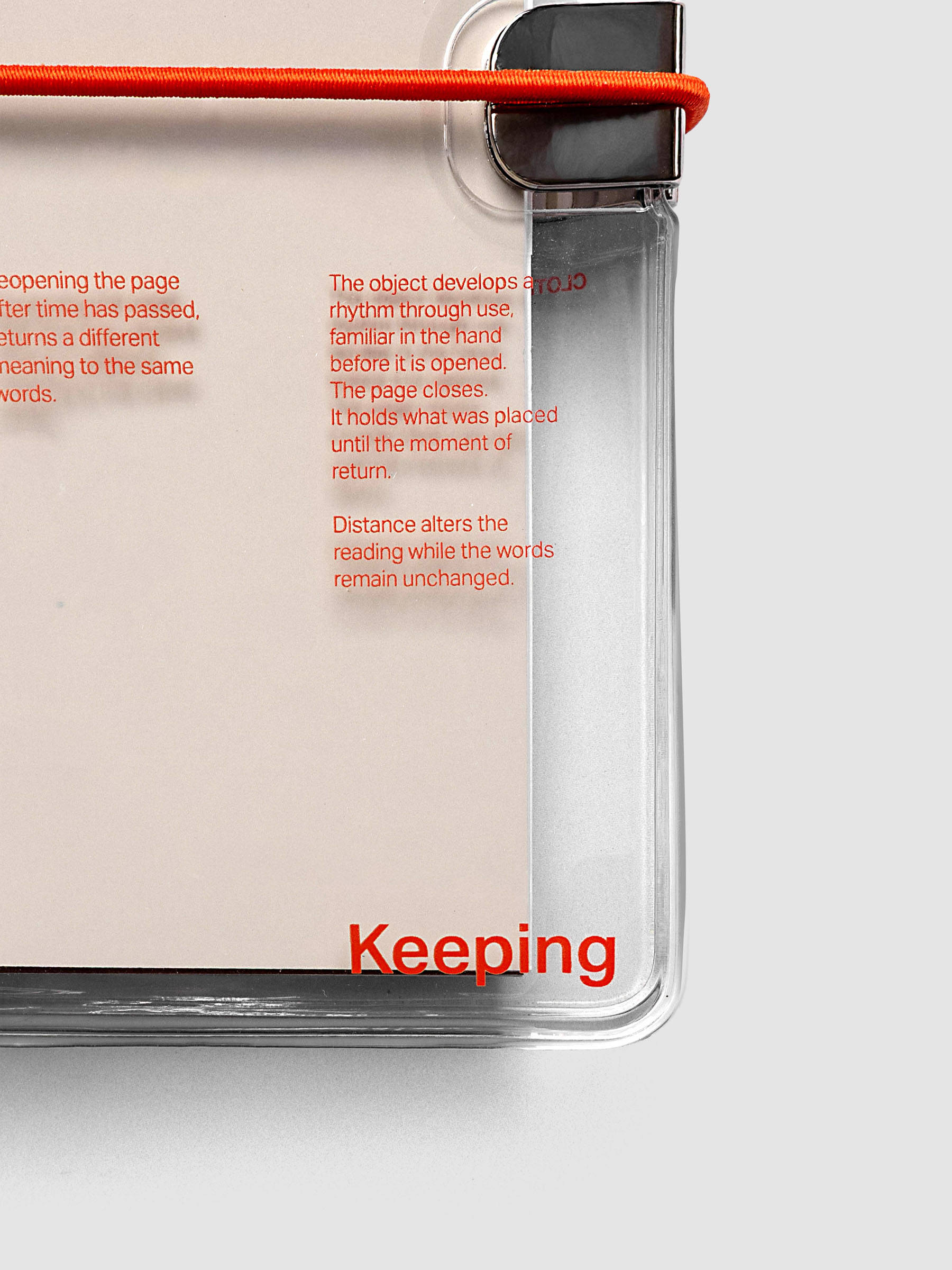 Close-up of the bottom right corner of the Act of Keeping Travel Notebook Cover in Pocket Plus size with travel notebooks inside, showing deep orange band detail