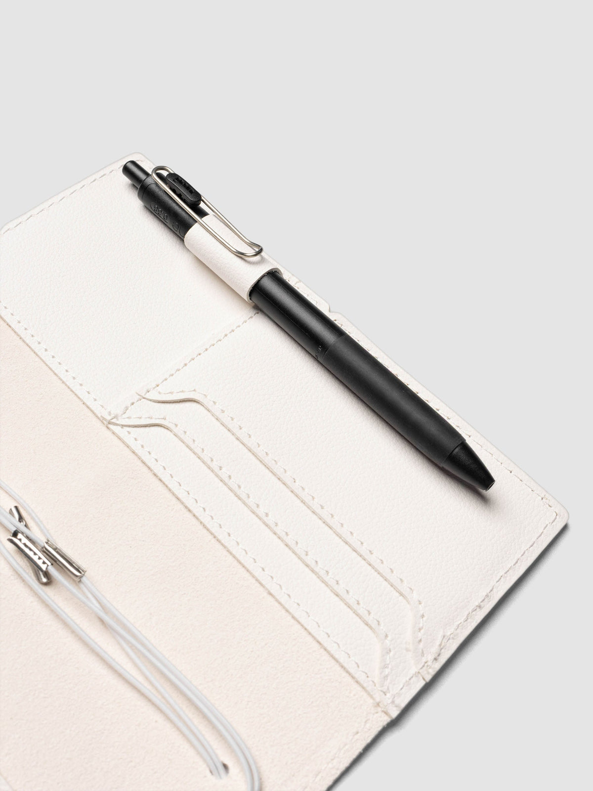 Dalmatian Pocket Plus Travel Notebook Cover showing the interior with a pen in the pen loop | Cloth & Paper
