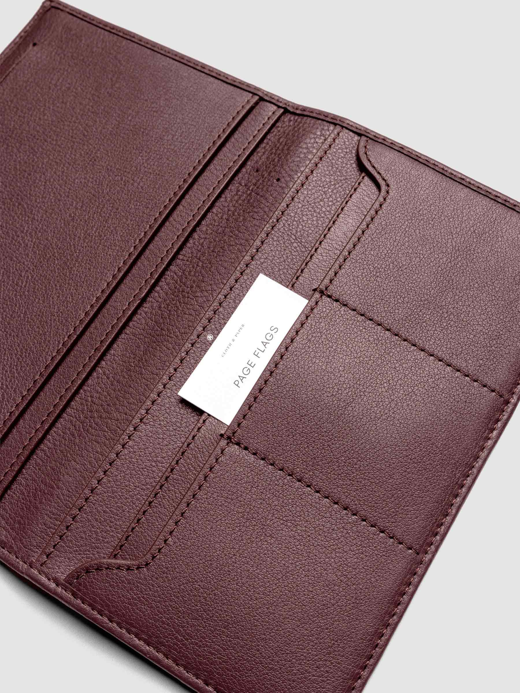 Close-up of Nomada Wallet credit card pockets in Madrid with a page flag tucked into one slot