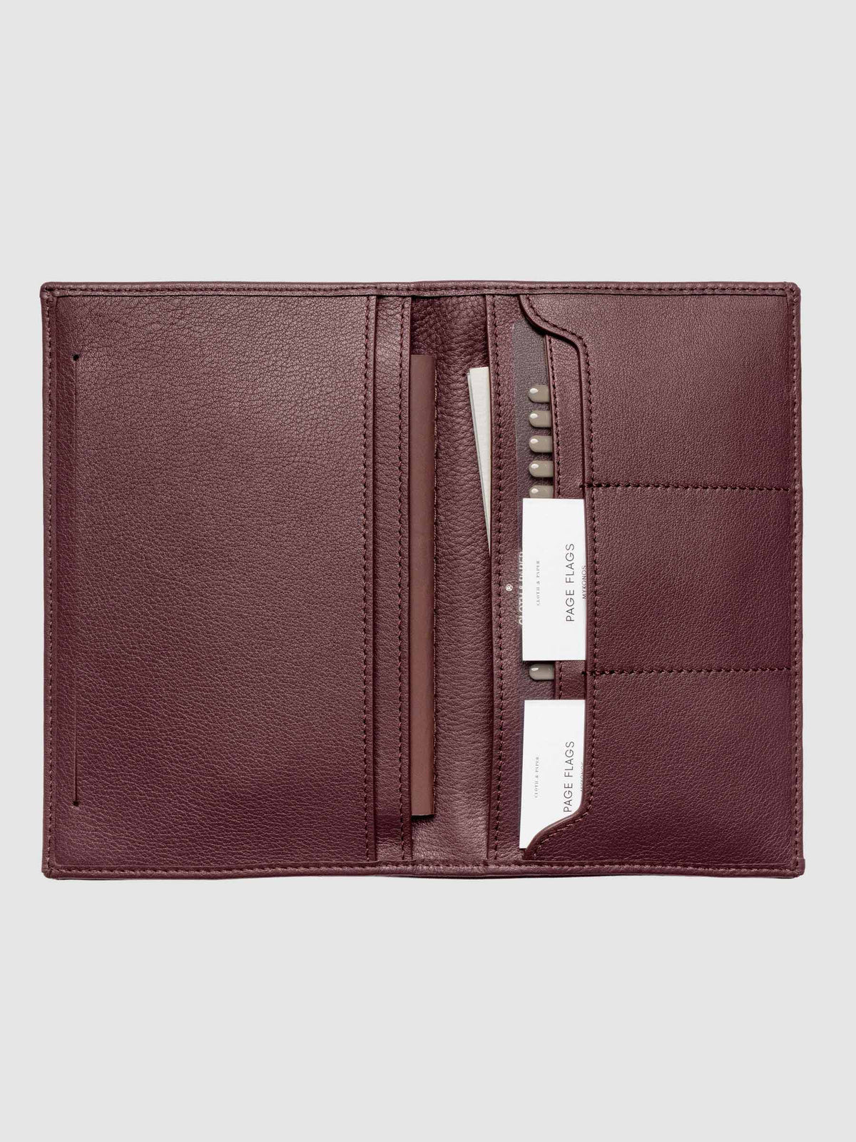 Nomada Wallet in Madrid open with Cloth & Paper products in pockets, full product view