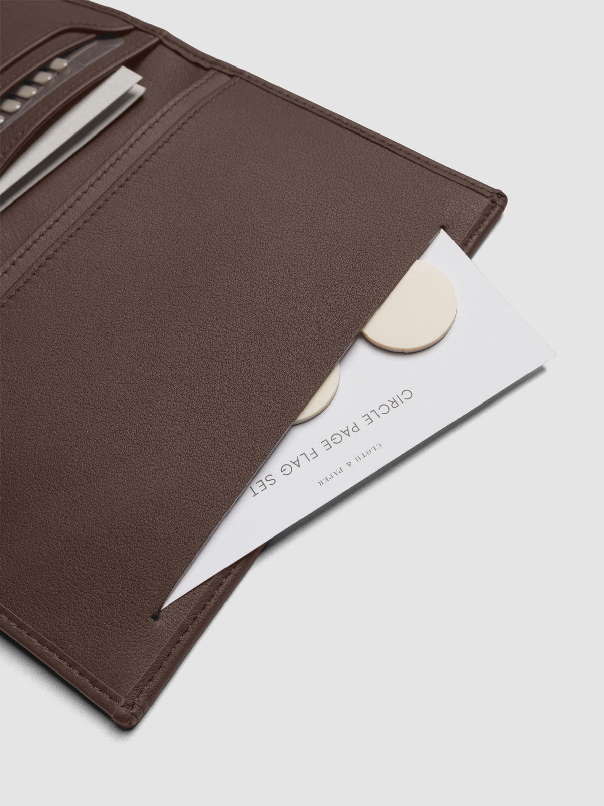 Close-up of Nomada Wallet slit pocket in Cordoba with page flags inside