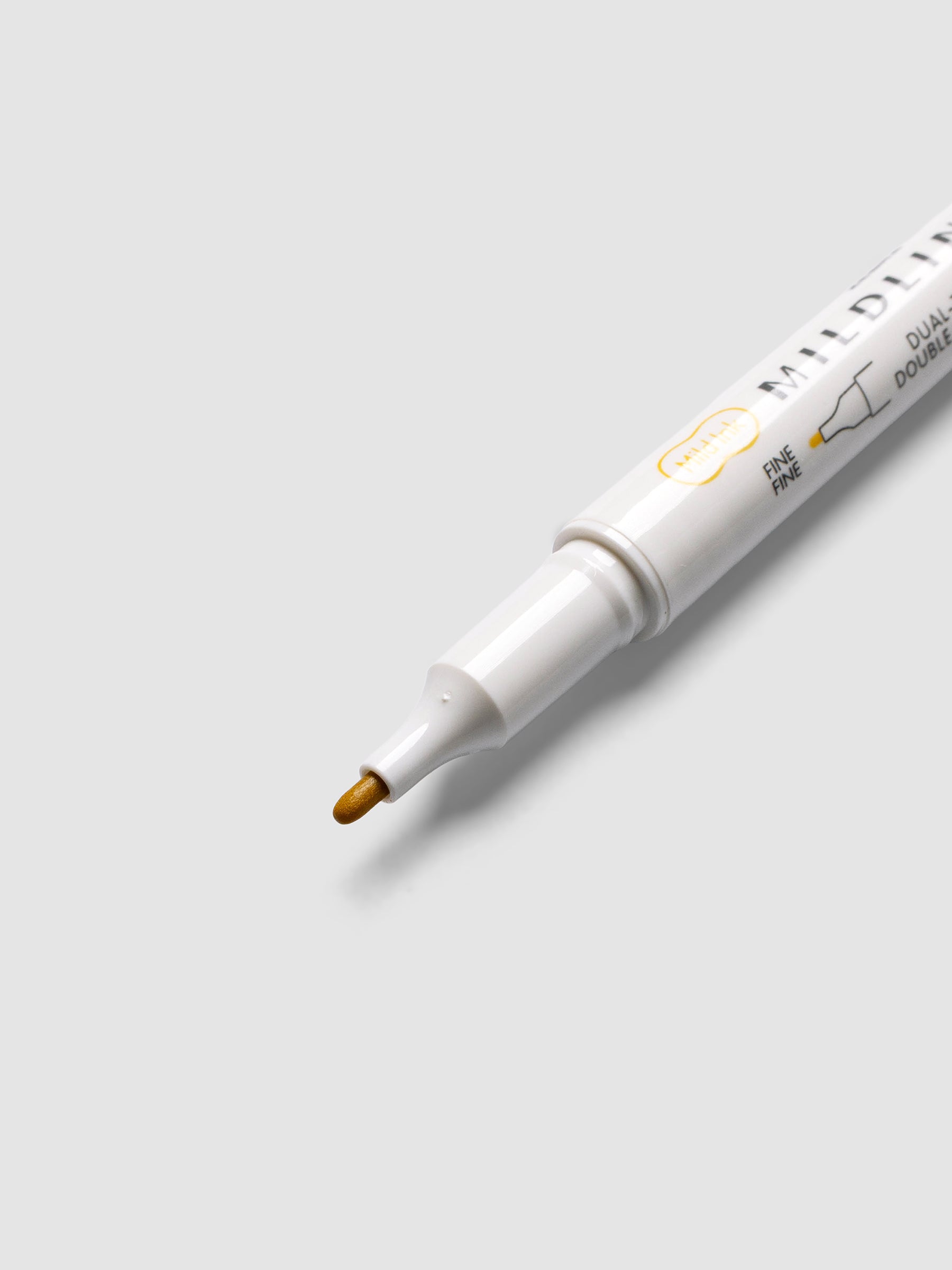 Close-up of Zebra Mildliner Dual-Tip Fineliner fine bullet tip in gold