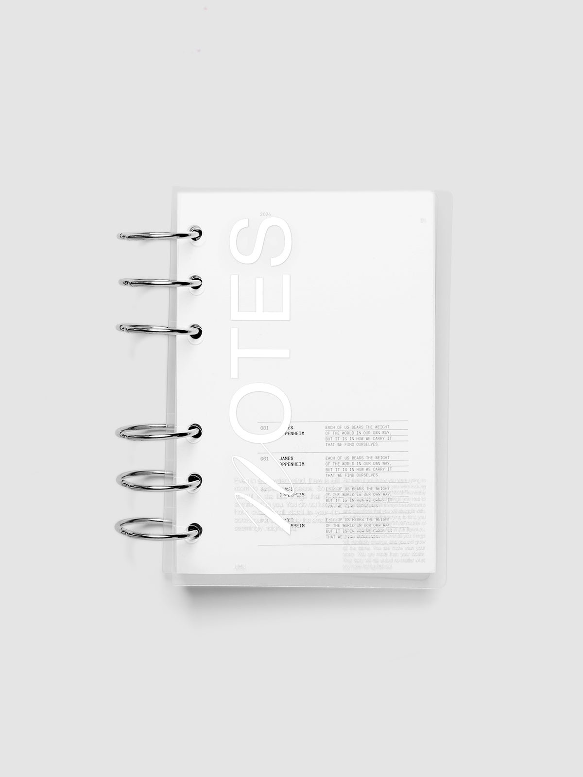 Clear plastic planner cover with white printed text shown pre-punched for A6 6-ring planners.