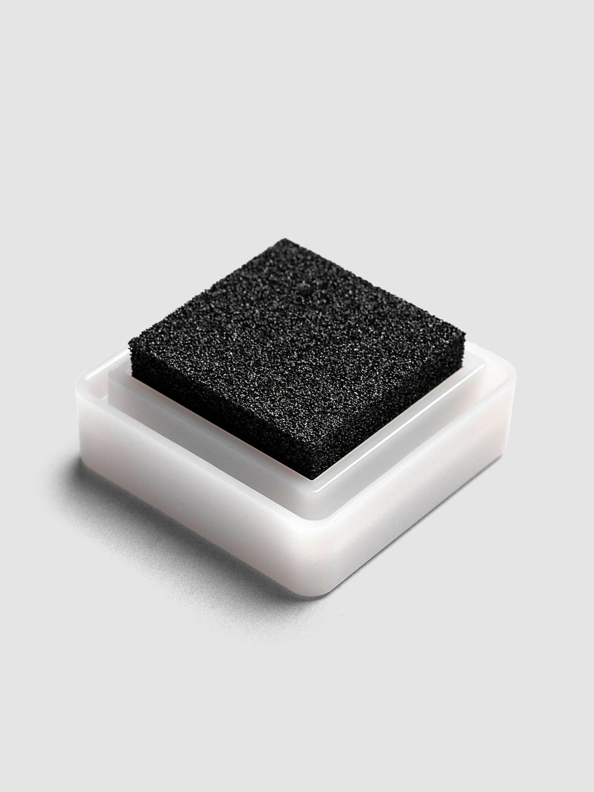Artnic Stamp Ink Pad in charcoal seen from the side with cover removed