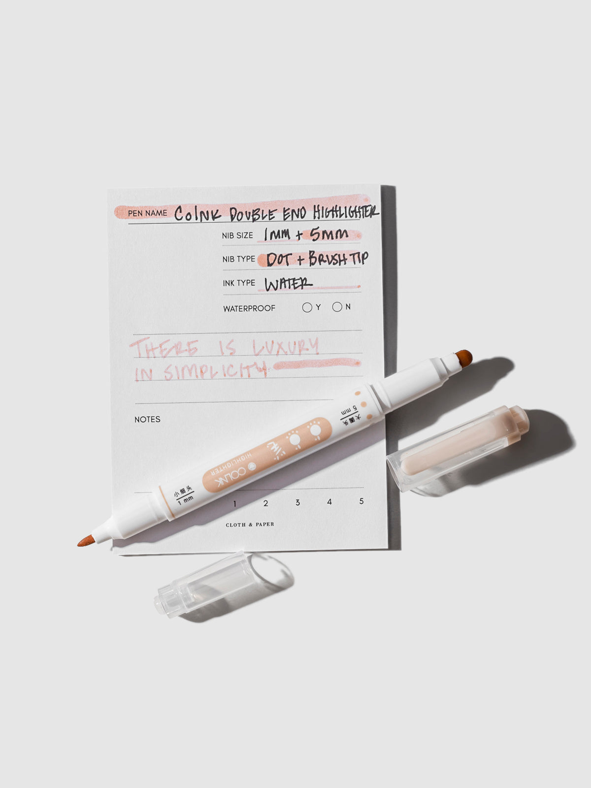 Colnk Double Ended Highlighter with caps displayed on a pen testing sticky note.