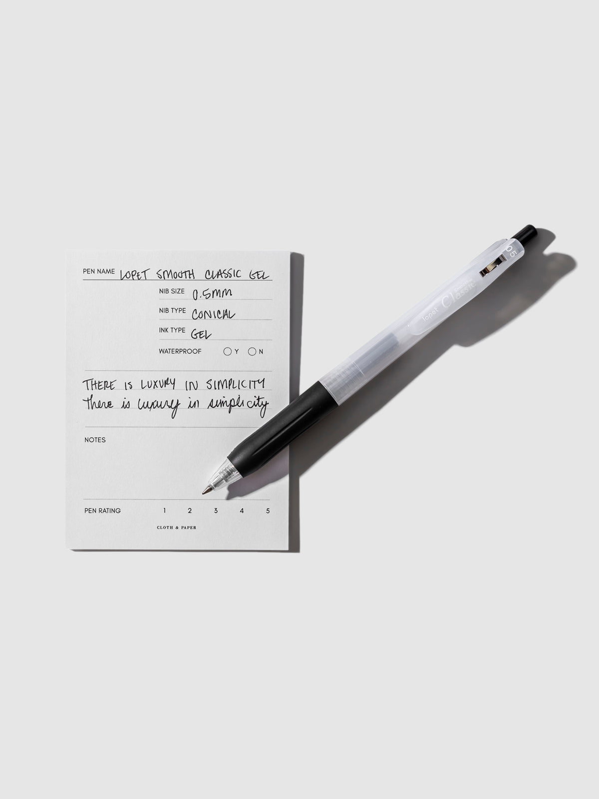Lopet Smooth Classic Gel Pen resting on a pen testing sticky note.