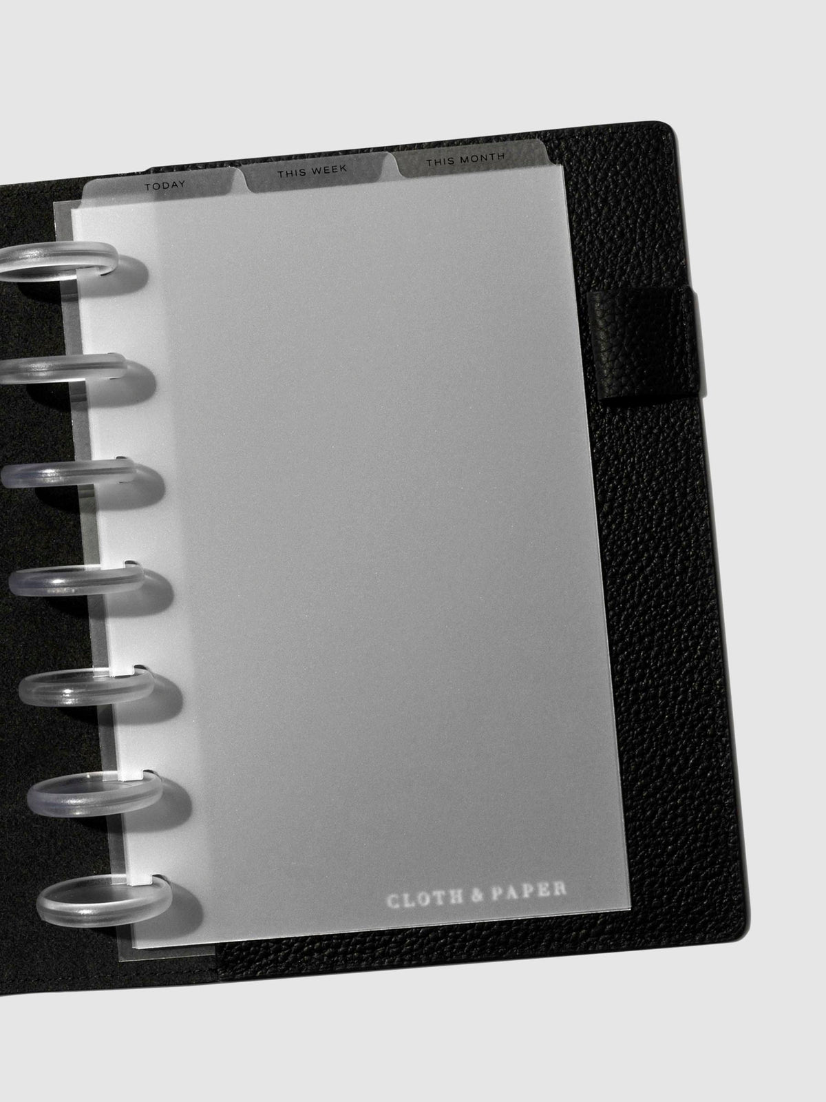 HP Mini Black Foil Cadence Tab Dividers displayed in a black leather planner.