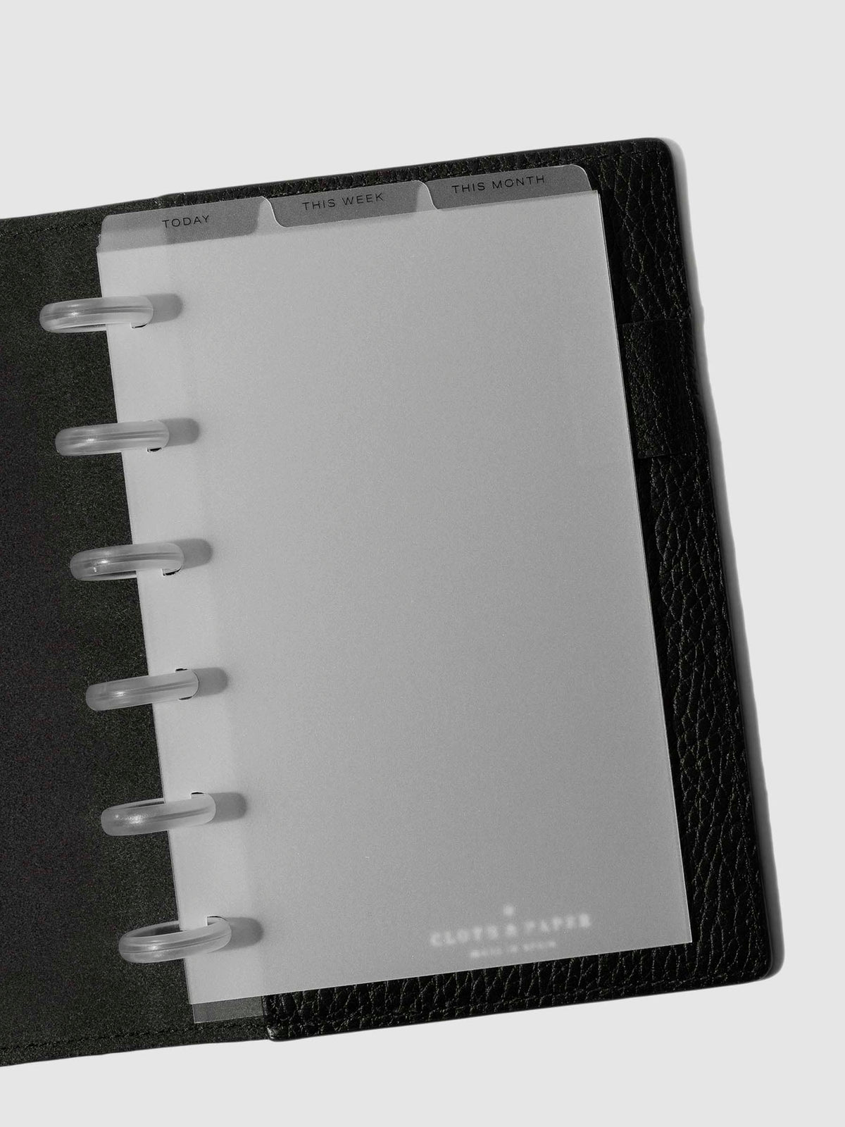 CP Petite Black Foil Cadence Tab Dividers displayed in a black leather planner.