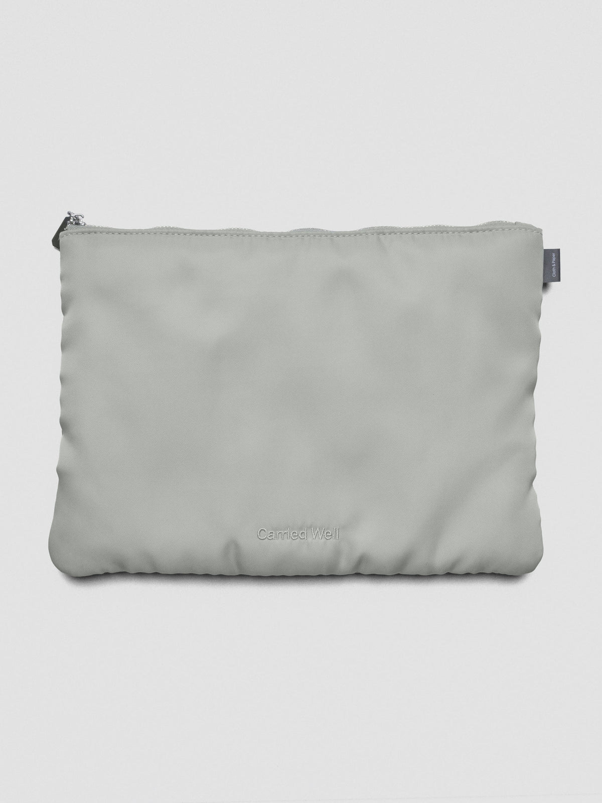 Light green-grey nylon, zippered, padded travel case.