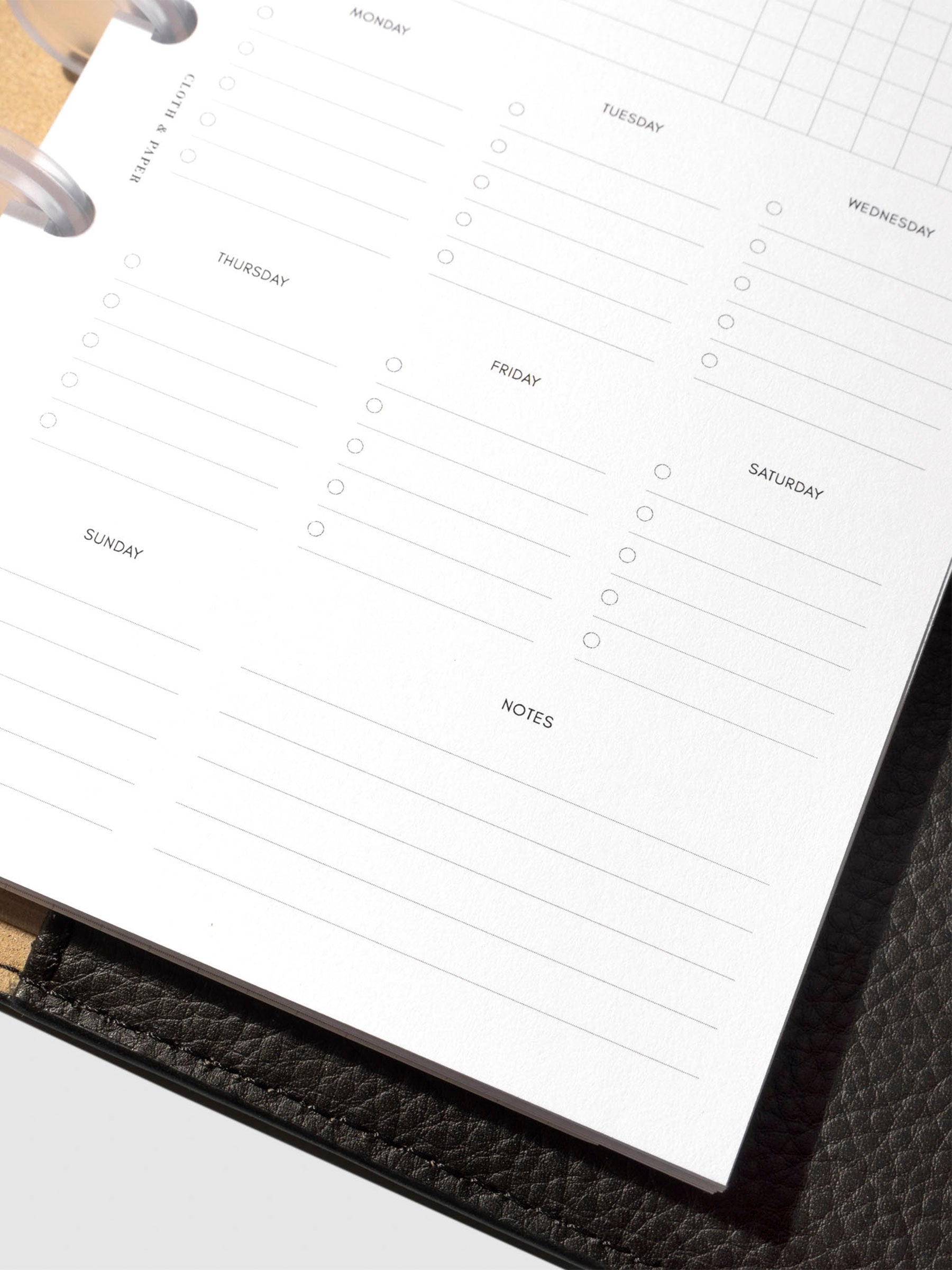 Insert in use inside a black leather planner.